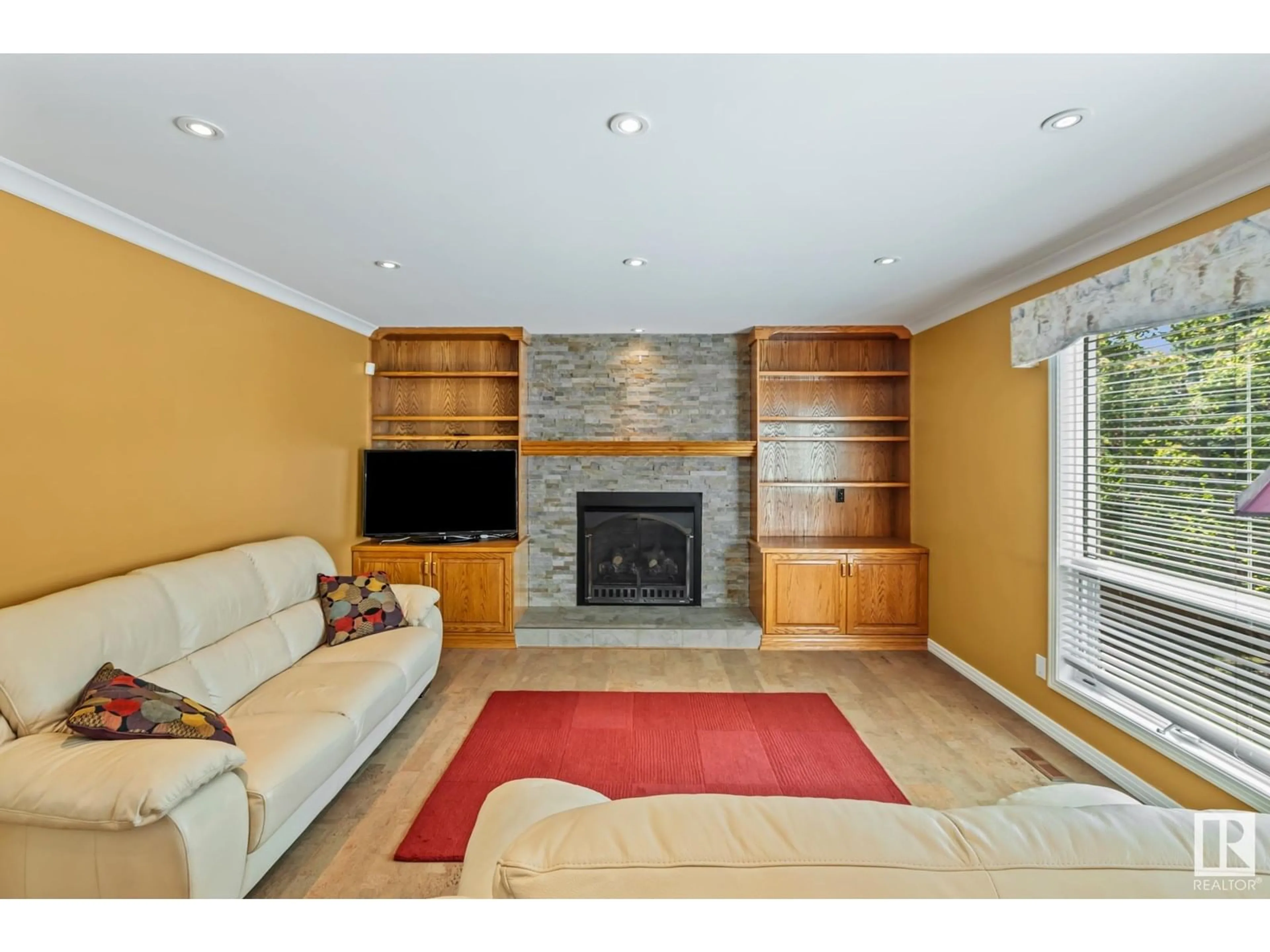 Living room with furniture, wood/laminate floor for 322 BURTON RD, Edmonton Alberta T6R2G7