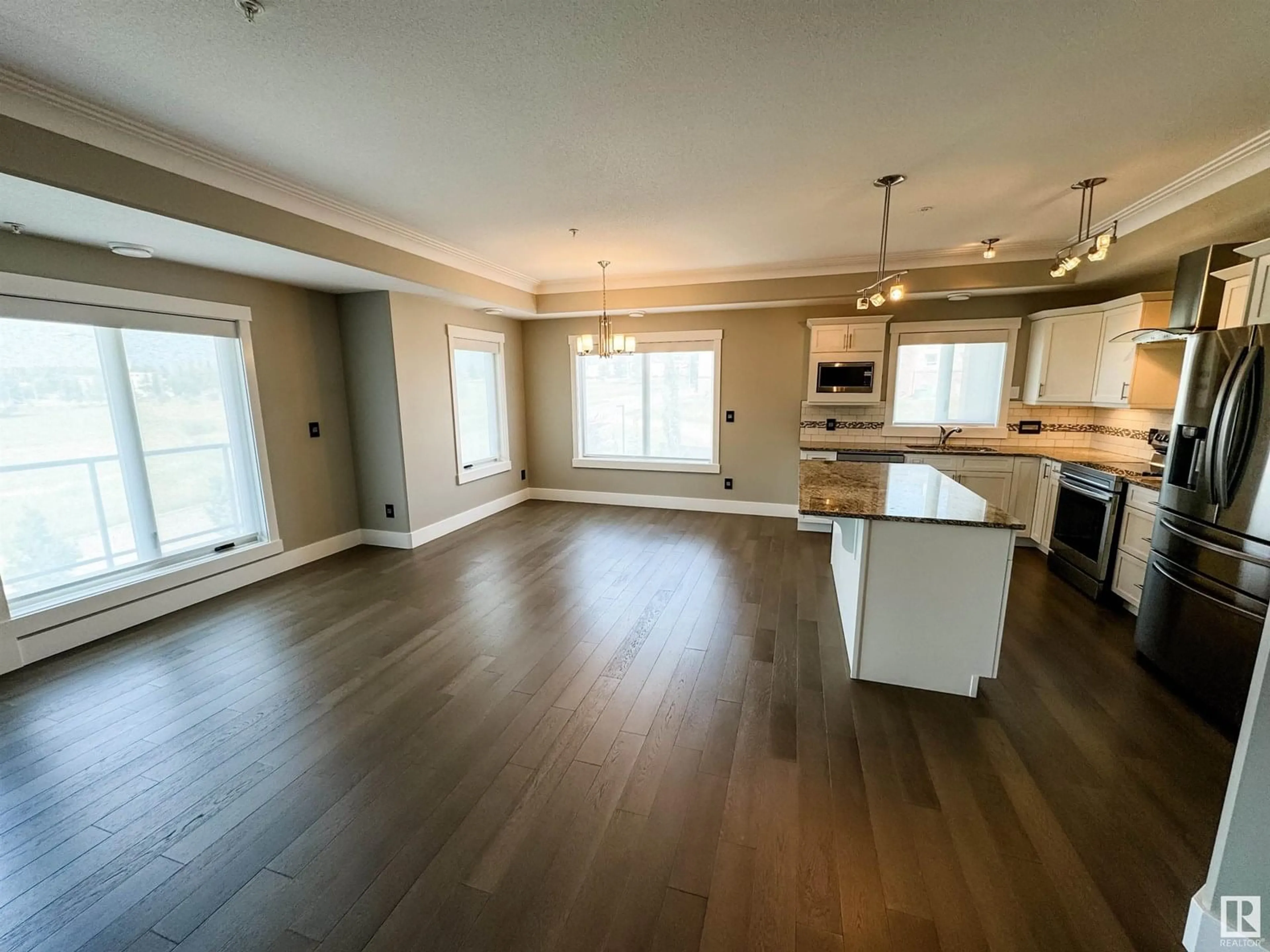 Open concept kitchen, wood/laminate floor for 309 - 5201 BROUGHAM DR, Drayton Valley Alberta T7A0C8
