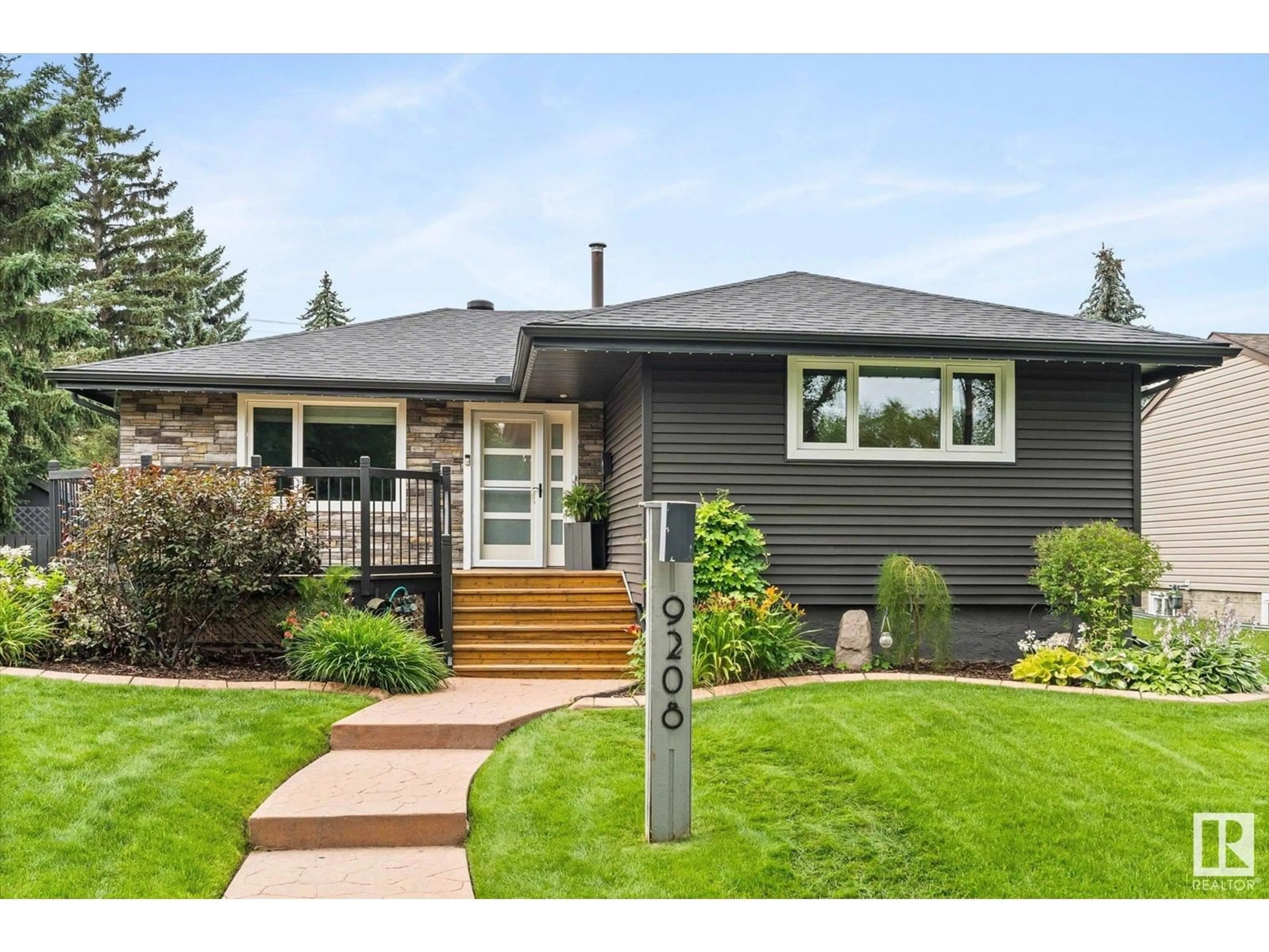 Home with vinyl exterior material, street for 9208 148 ST, Edmonton Alberta T5R1A3