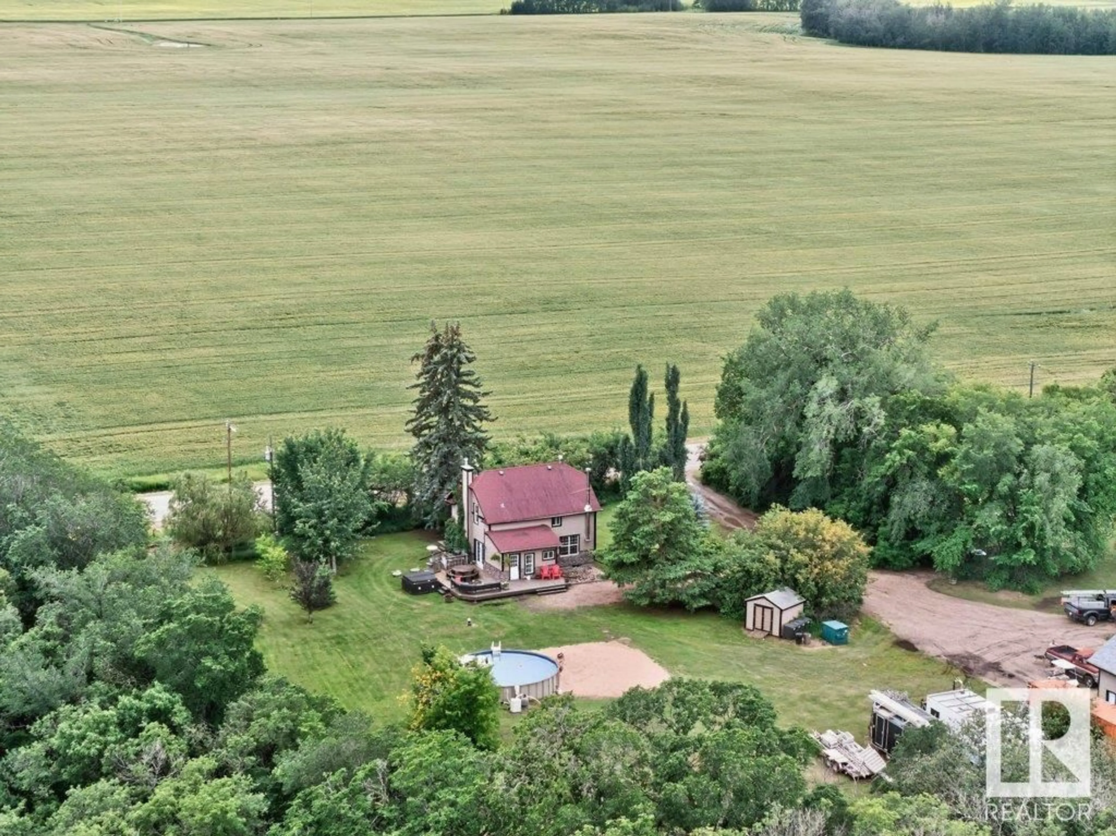 A pic from outside/outdoor area/front of a property/back of a property/a pic from drone, unknown for 26542 TWP ROAD 504, Rural Leduc County Alberta T9G0J9