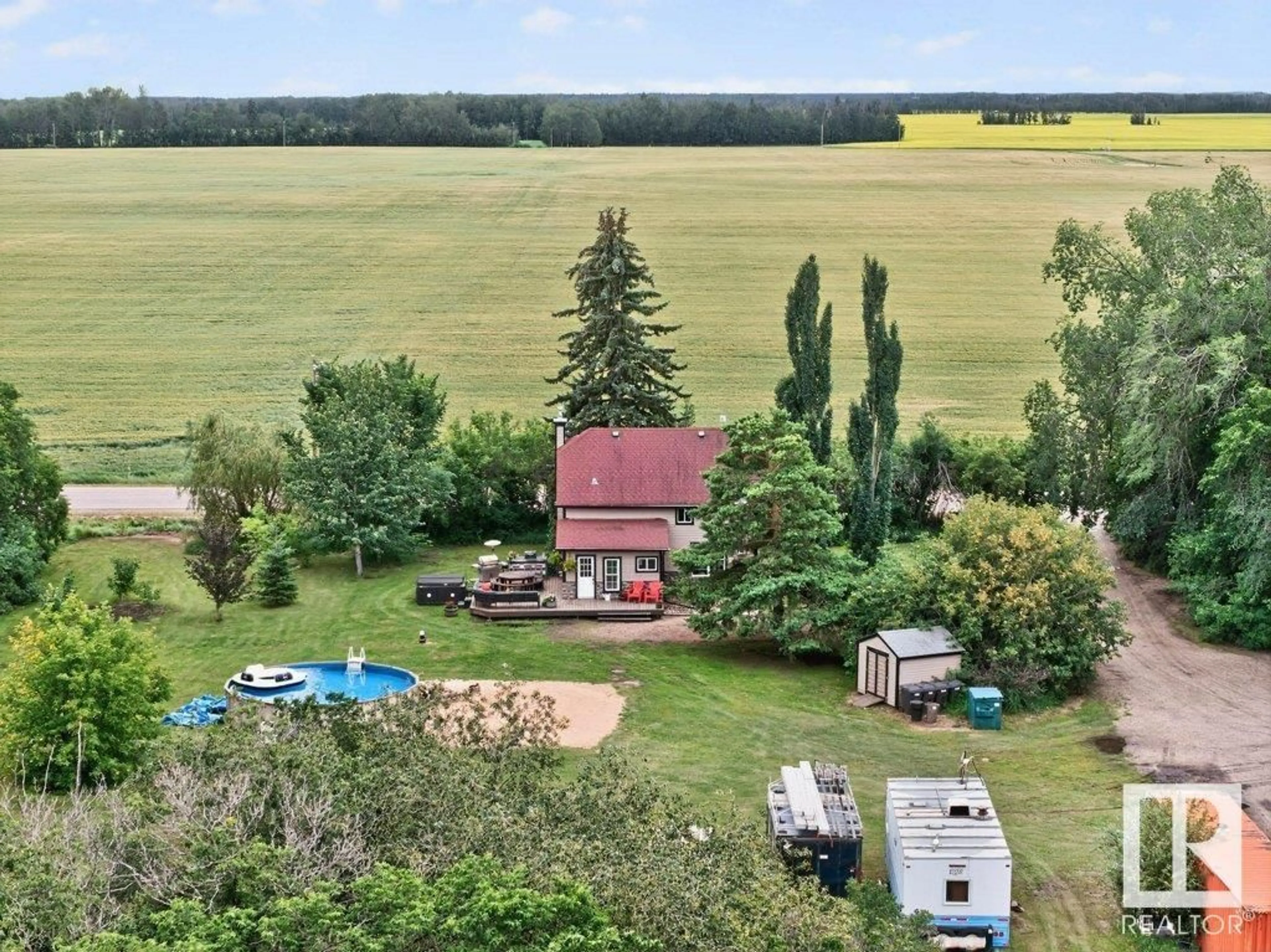 A pic from outside/outdoor area/front of a property/back of a property/a pic from drone, unknown for 26542 TWP ROAD 504, Rural Leduc County Alberta T9G0J9