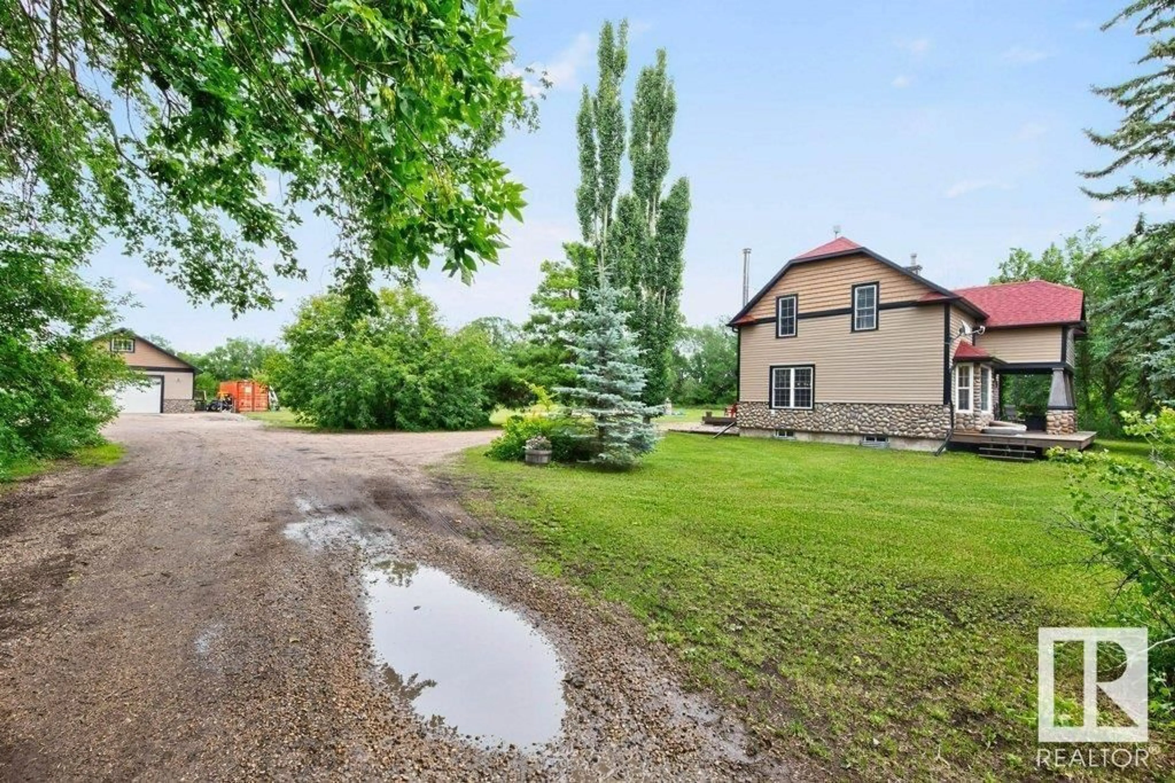 A pic from outside/outdoor area/front of a property/back of a property/a pic from drone, unknown for 26542 TWP ROAD 504, Rural Leduc County Alberta T9G0J9