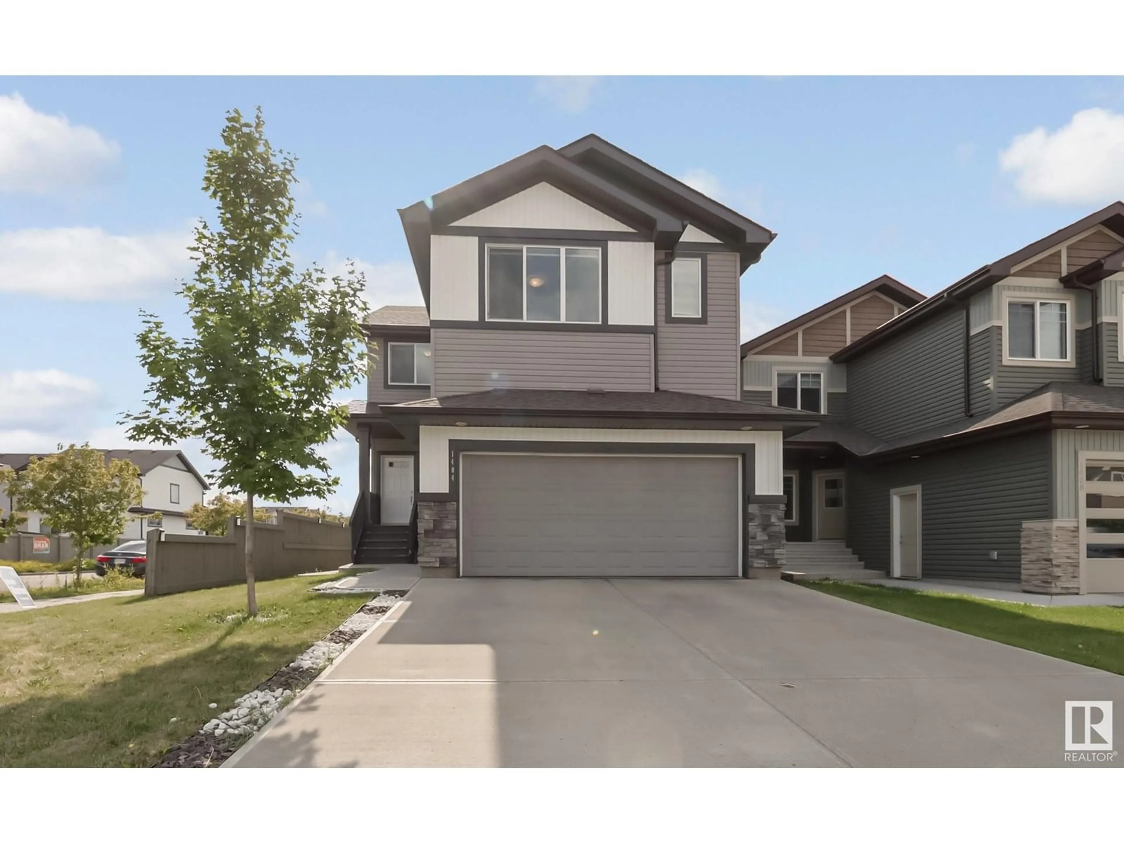 Home with vinyl exterior material, street for NW - 1404 29 ST, Edmonton Alberta T6T1A8