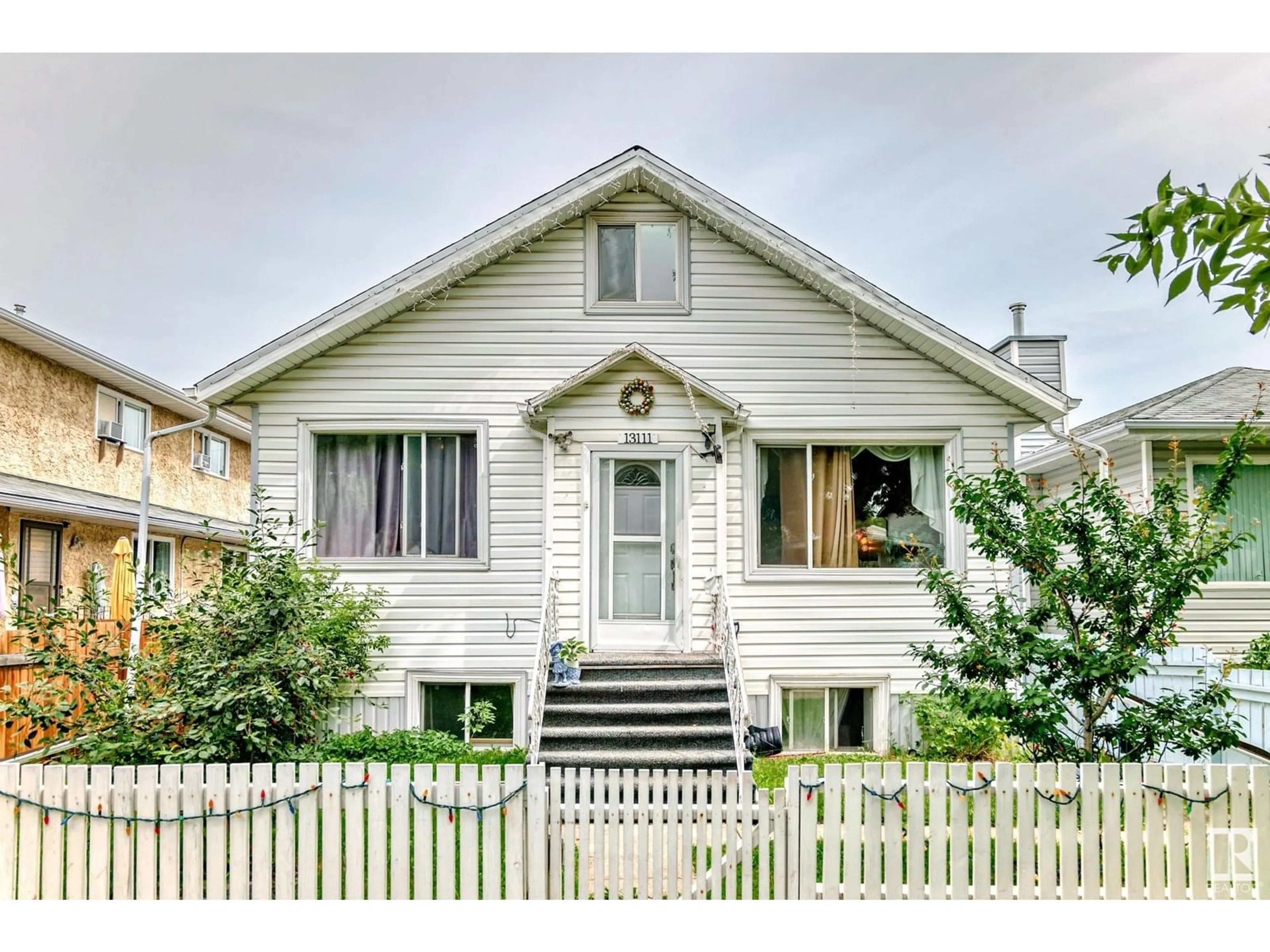 Home with vinyl exterior material, street for NW - 13111 65 ST, Edmonton Alberta T5A1A2