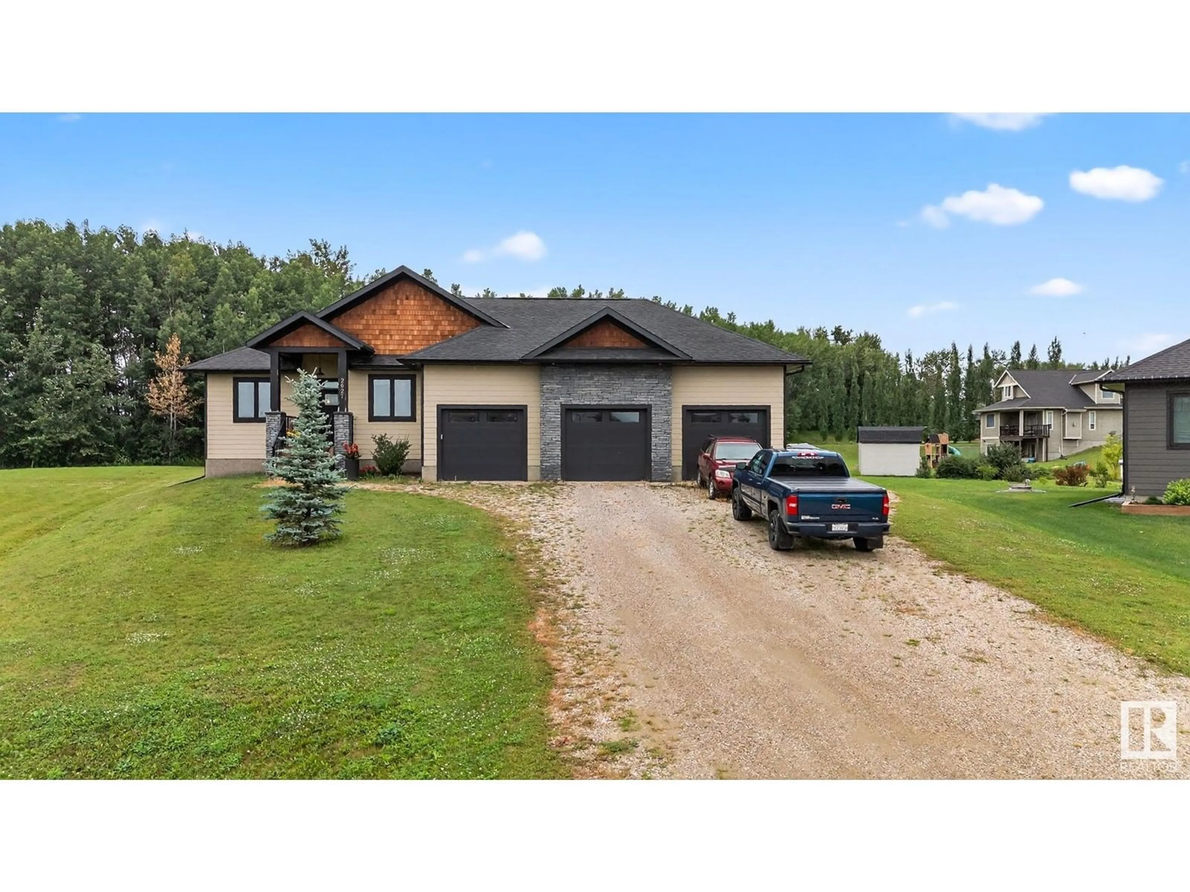A pic from outside/outdoor area/front of a property/back of a property/a pic from drone, street for 2027 JUNIPER LN, Rural Parkland County Alberta T7Z0G8