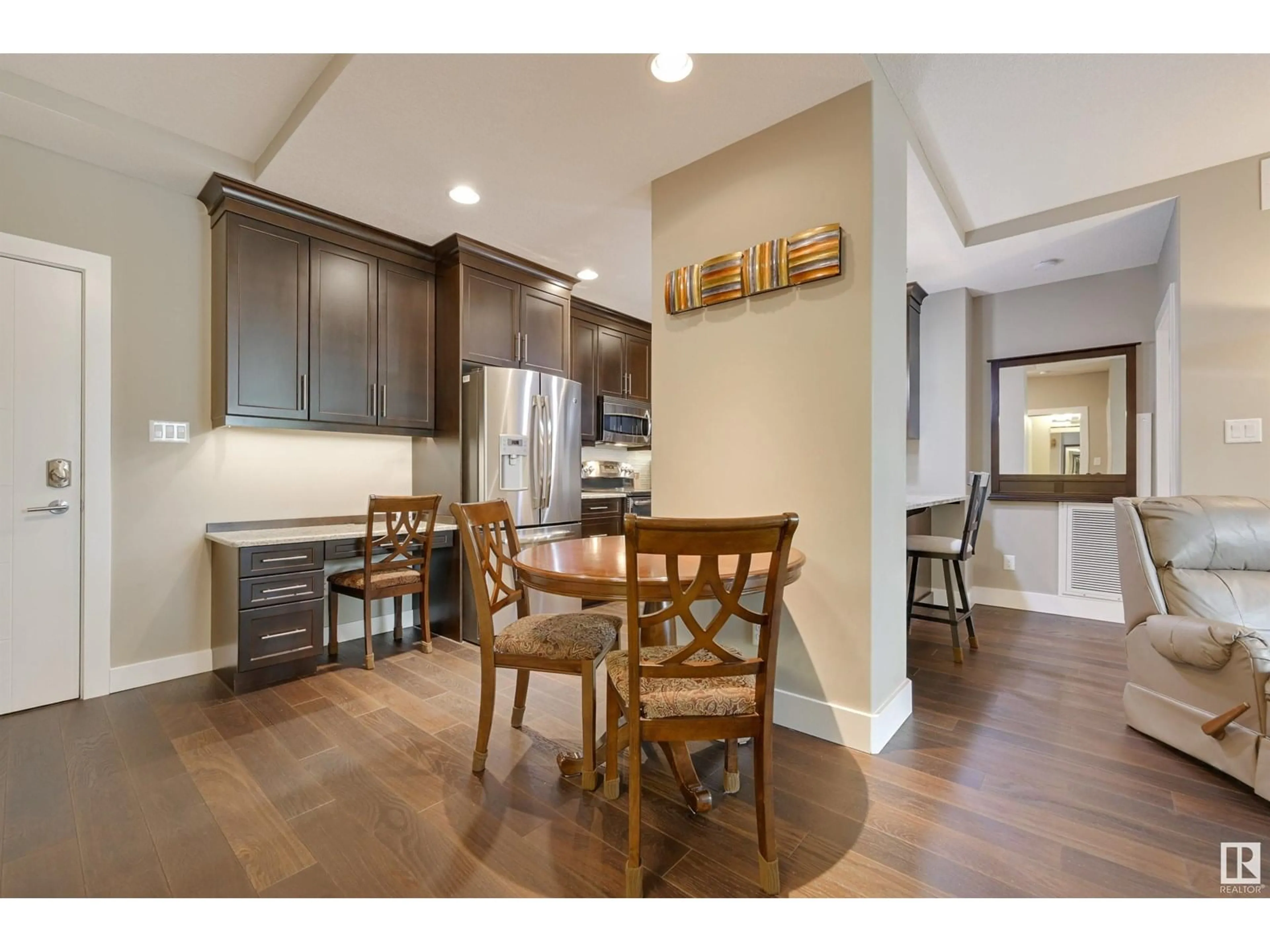 Open concept kitchen, wood/laminate floor for #221 - 11080 ELLERSLIE RD, Edmonton Alberta T6W2C2