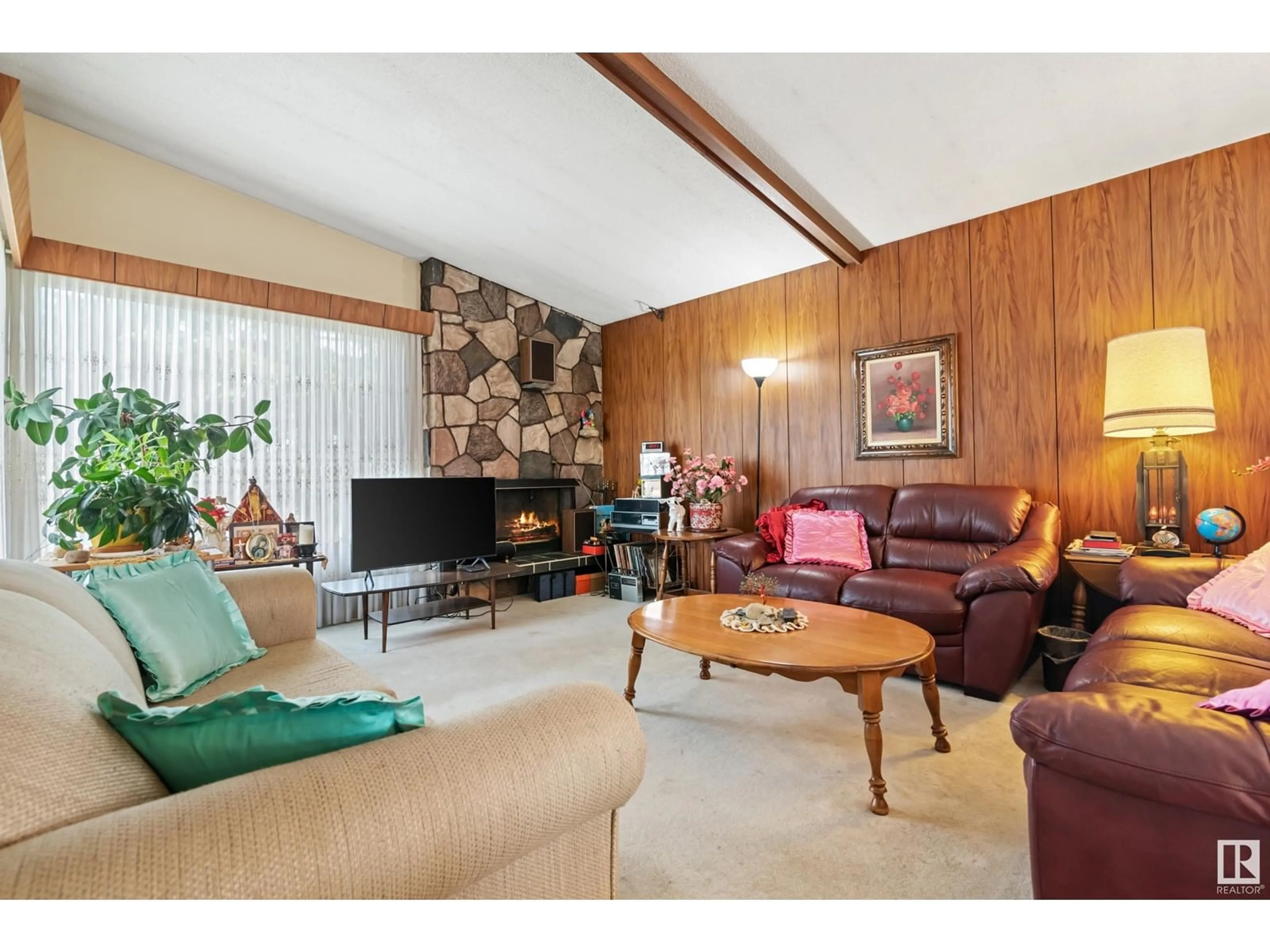 Living room with furniture, wood/laminate floor for NW - 7407 88 AV, Edmonton Alberta T6B0M4