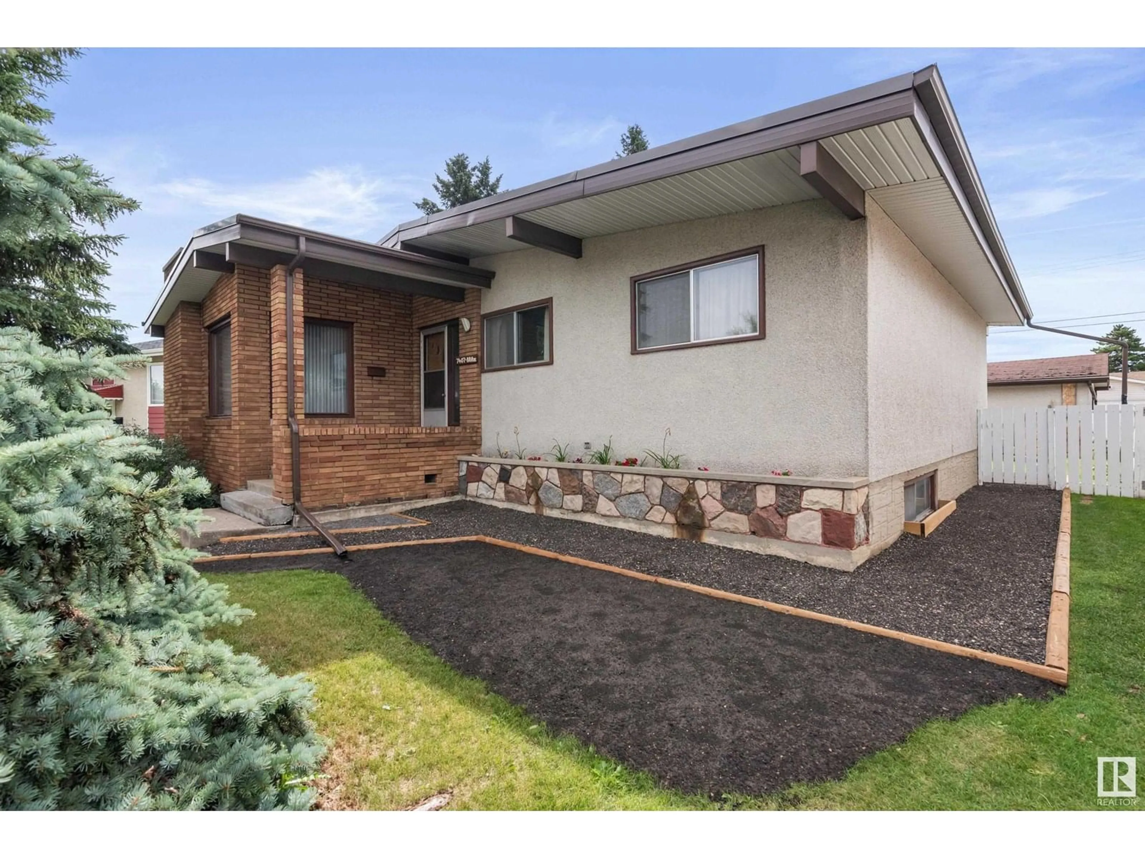 Home with brick exterior material, street for NW - 7407 88 AV, Edmonton Alberta T6B0M4