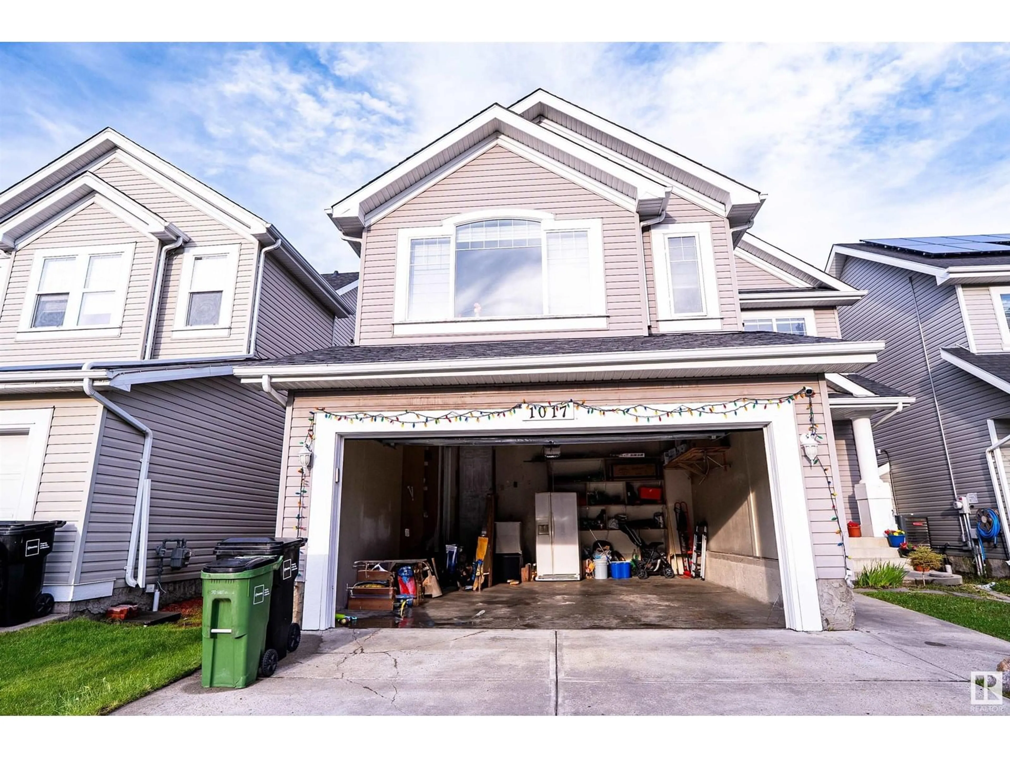 Home with vinyl exterior material, street for 1017 82 ST, Edmonton Alberta T6X1E4