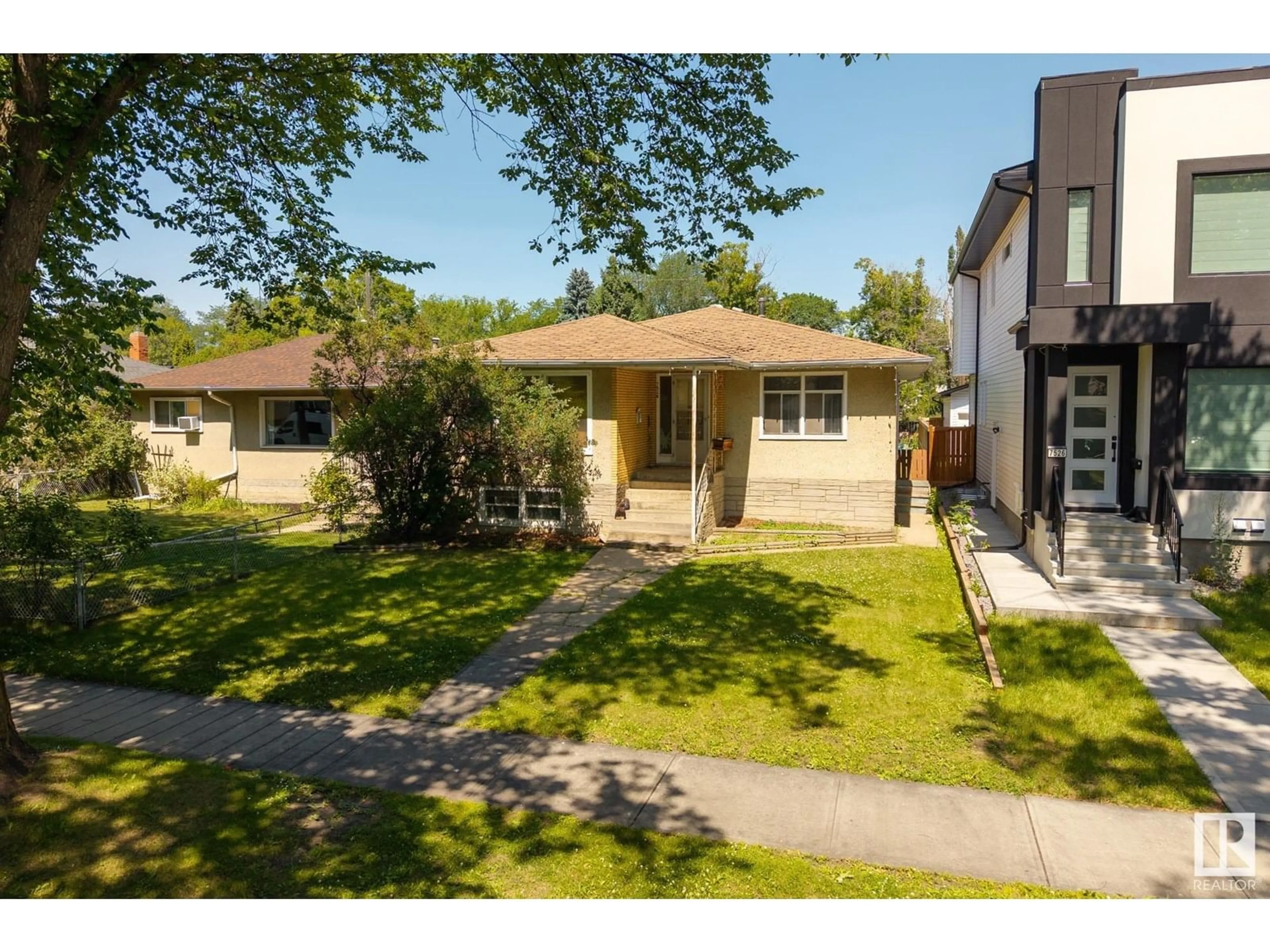 A pic from outside/outdoor area/front of a property/back of a property/a pic from drone, street for 7528 80 AV, Edmonton Alberta T6C0S4
