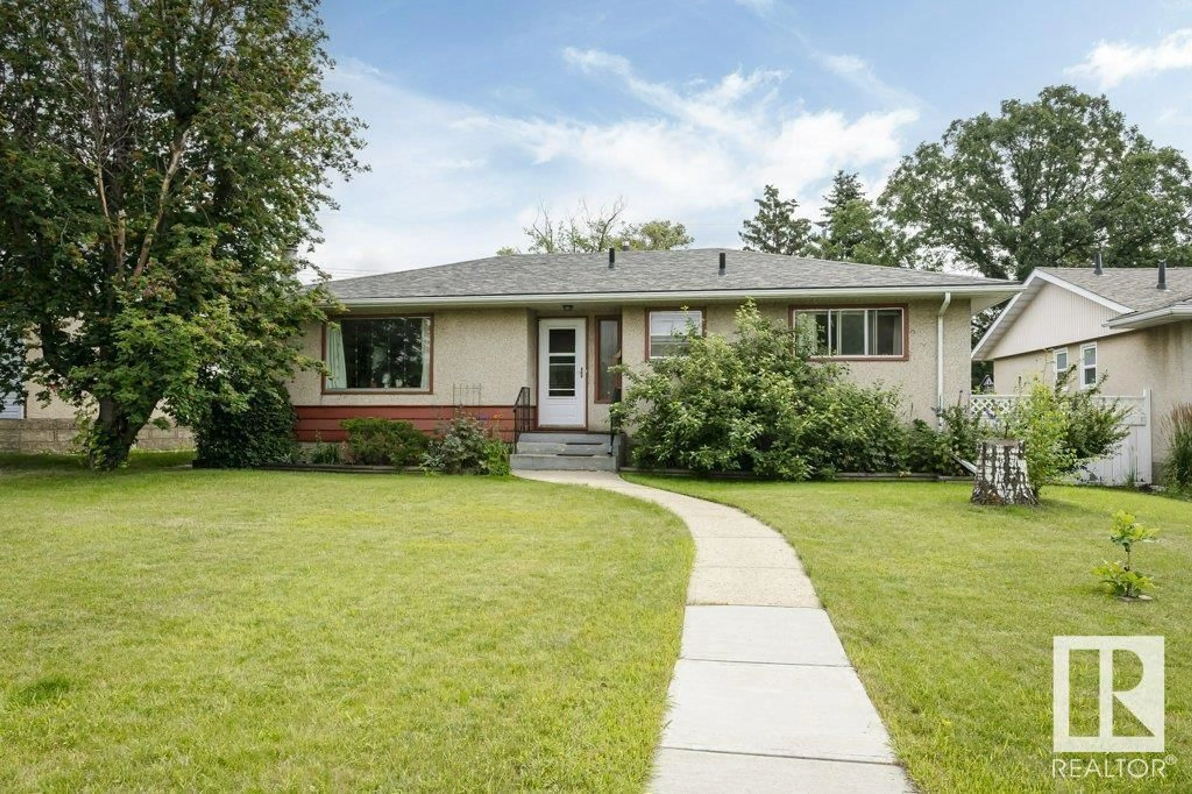 Home with vinyl exterior material, street for NW - 10671 67 ST, Edmonton Alberta T6A2R9