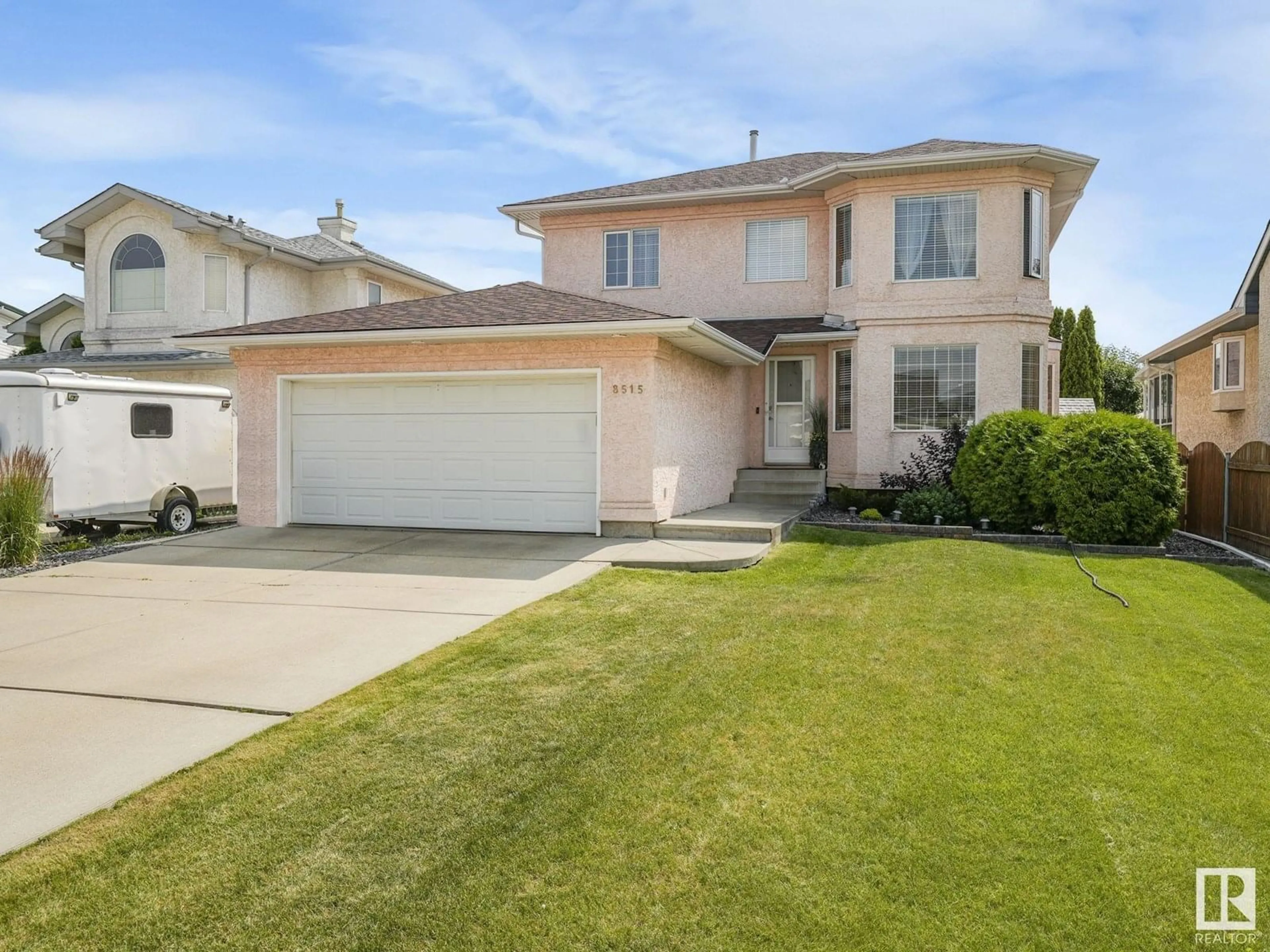 Home with vinyl exterior material, street for 8515 157 AV, Edmonton Alberta T5Z3B3