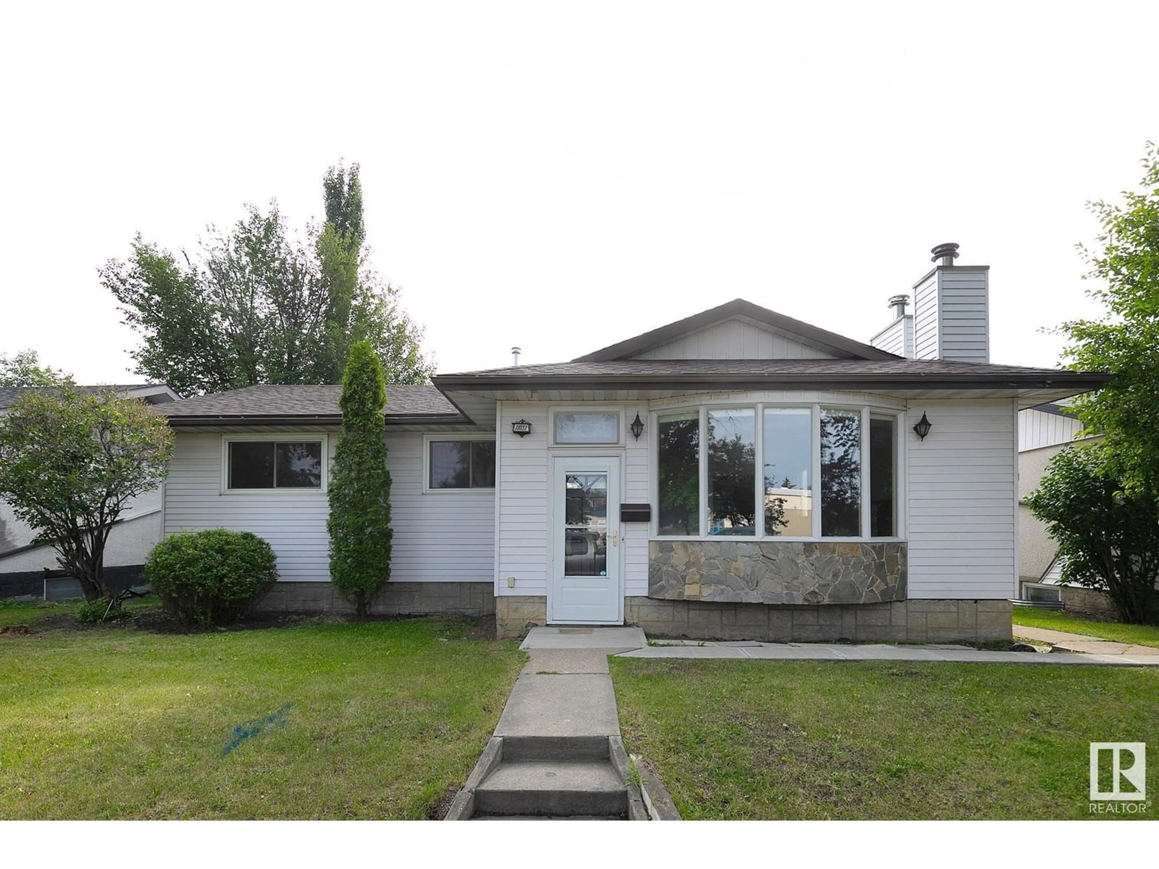 Home with vinyl exterior material, street for NW - 11031 153A ST, Edmonton Alberta T5P2E7