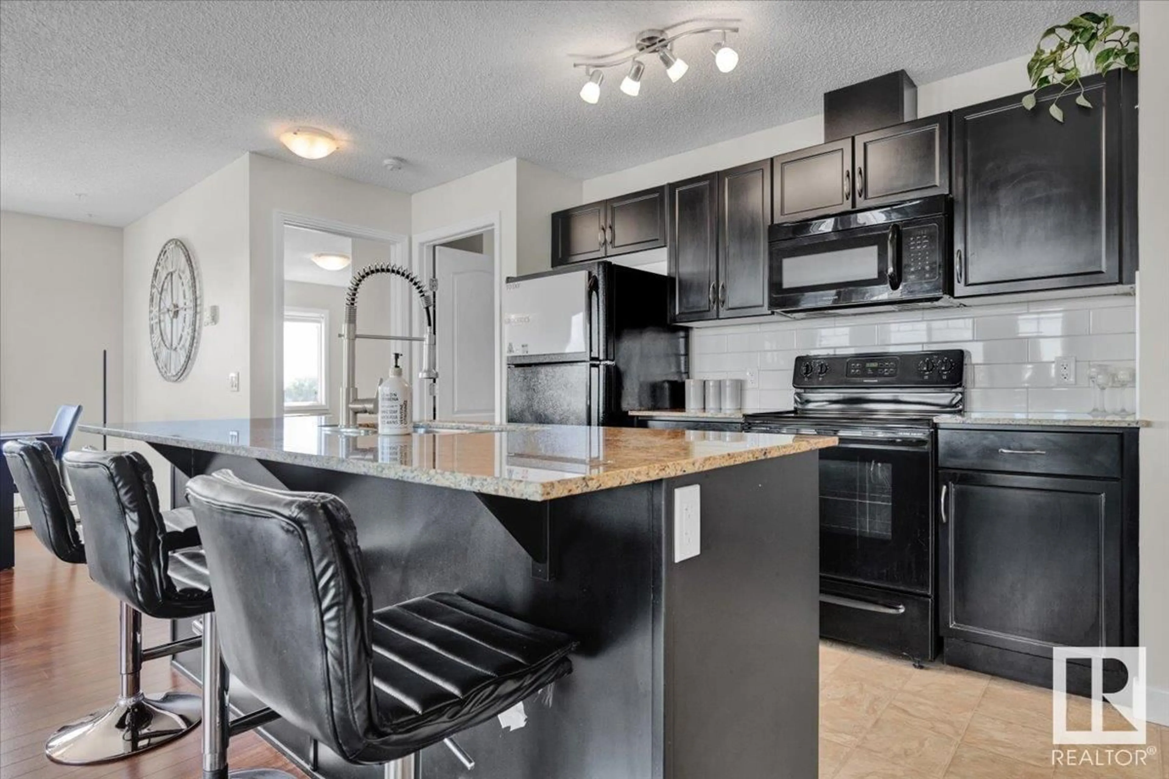 Open concept kitchen, unknown for #305 - 12650 142 AV, Edmonton Alberta T5X0J4