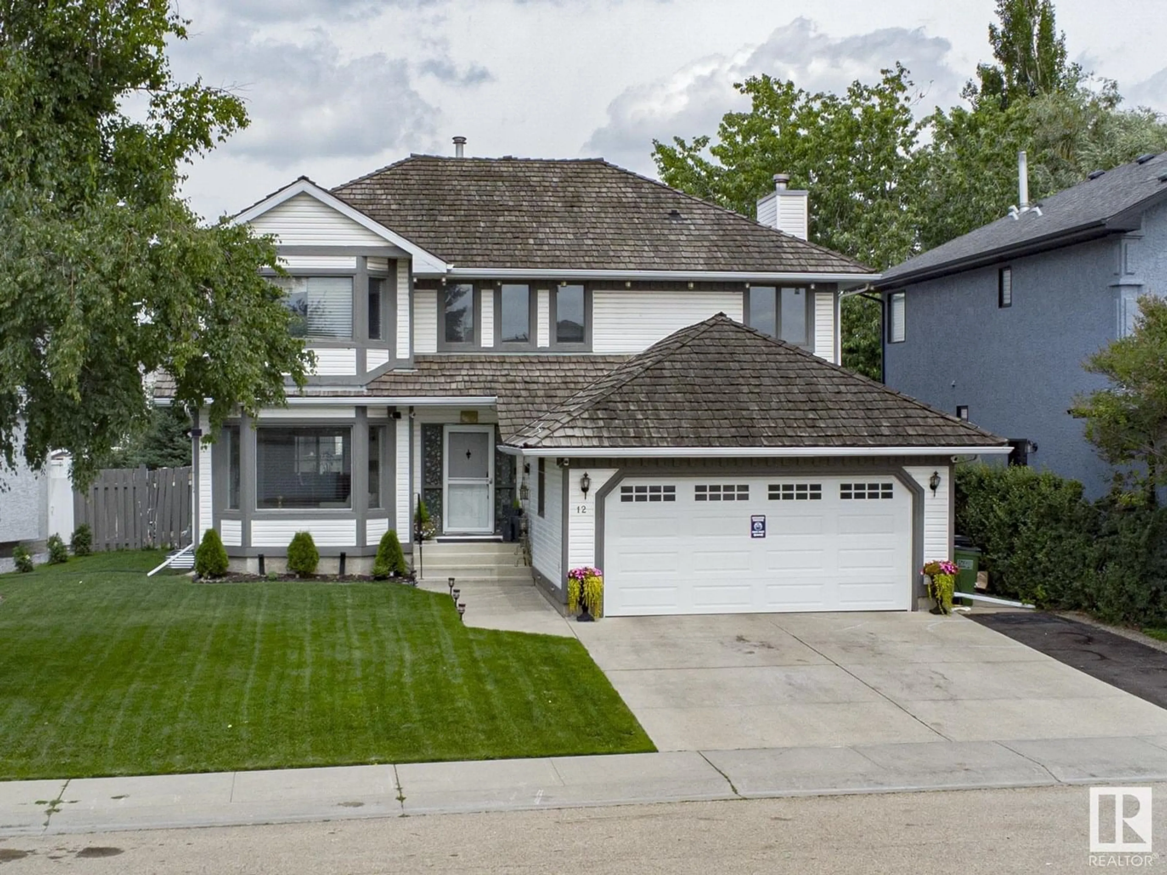 Home with vinyl exterior material, street for 12 ELSINORE PL, Edmonton Alberta T5X5W3
