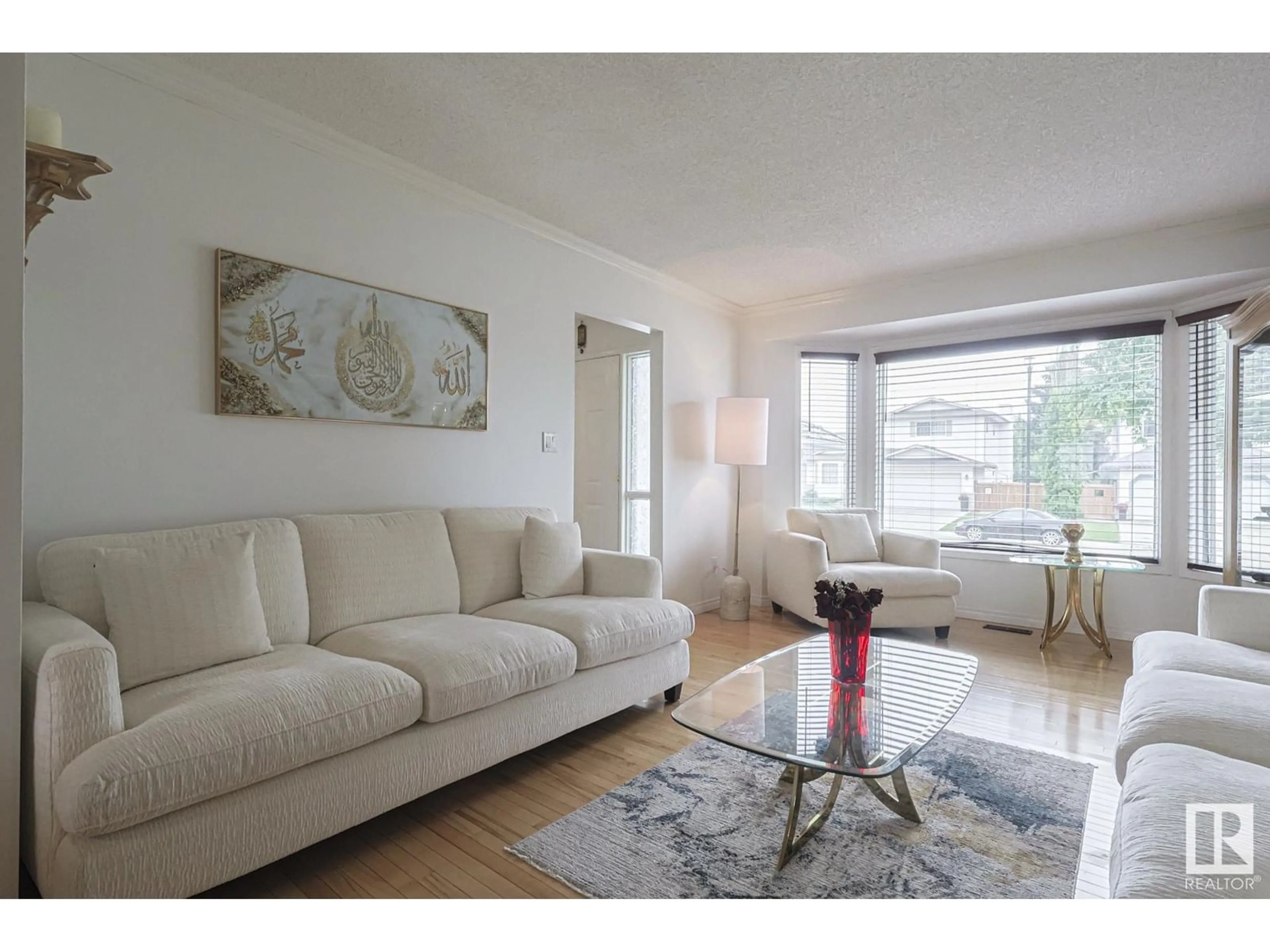 Living room with furniture, wood/laminate floor for 12 ELSINORE PL, Edmonton Alberta T5X5W3
