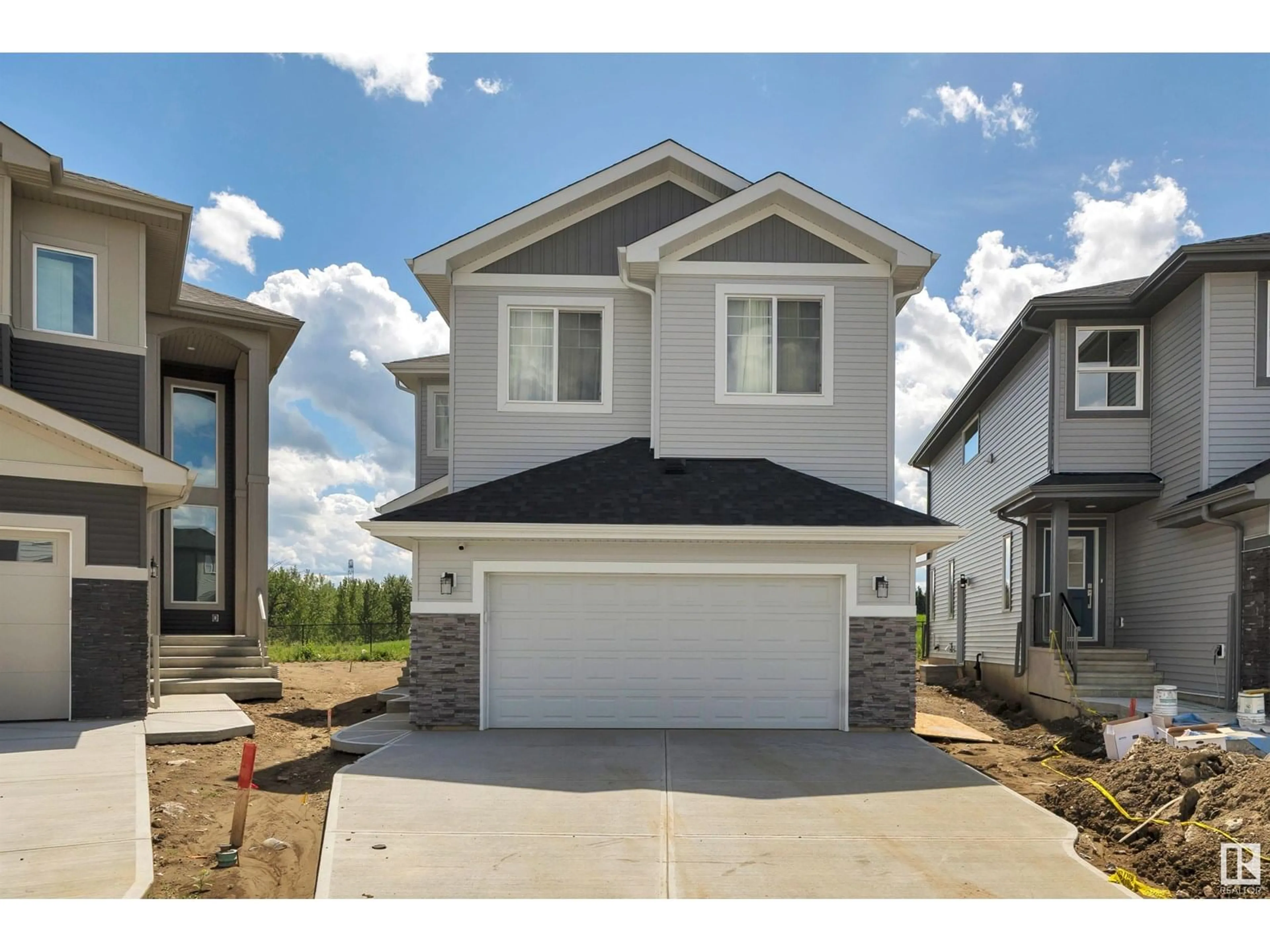 Home with vinyl exterior material, street for 1439 11 AV, Edmonton Alberta T6T2W4