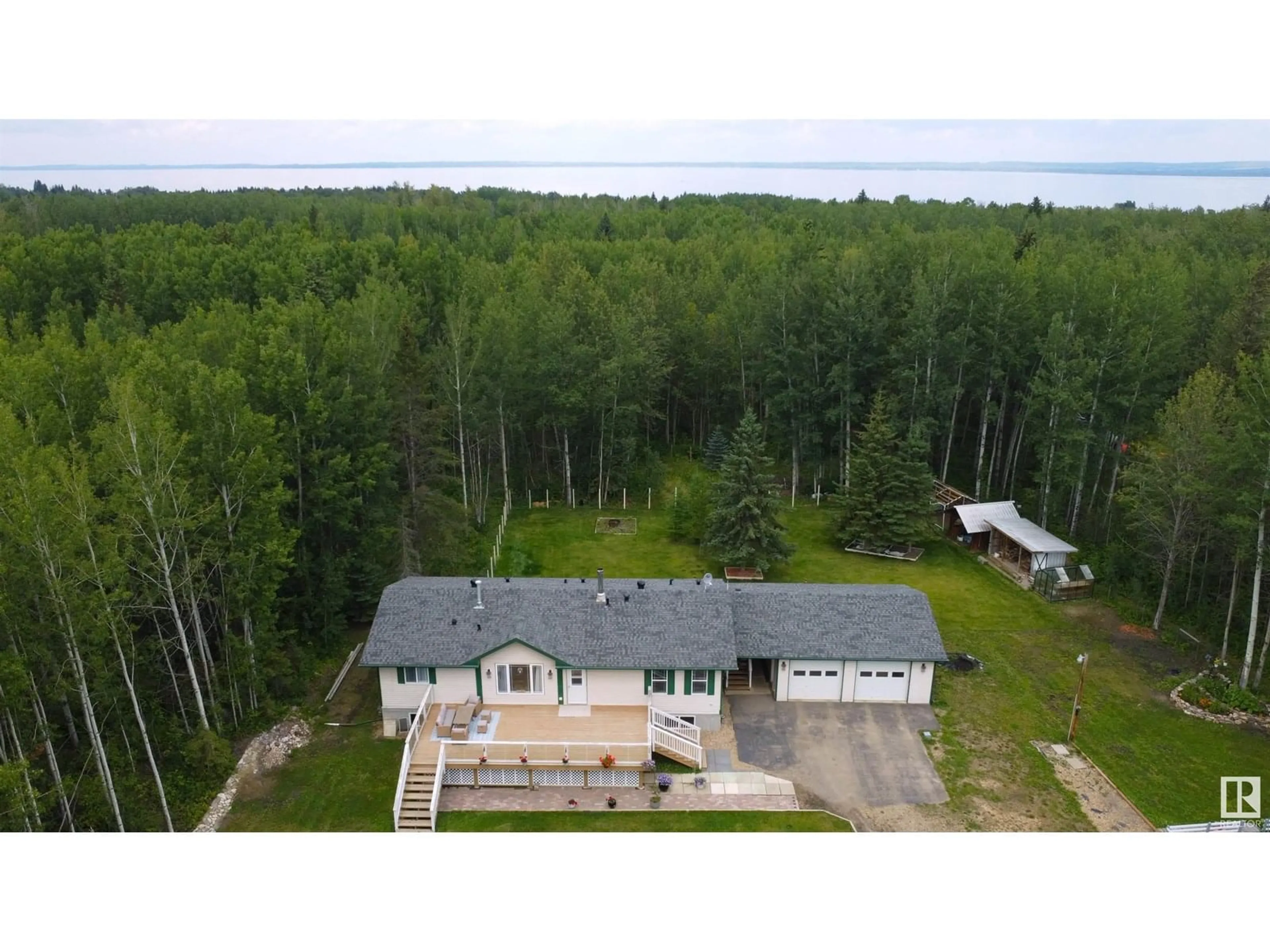A pic from outside/outdoor area/front of a property/back of a property/a pic from drone, water/lake/river/ocean view for 636 462014 RGE ROAD 10, Rural Wetaskiwin County Alberta T0C2V0