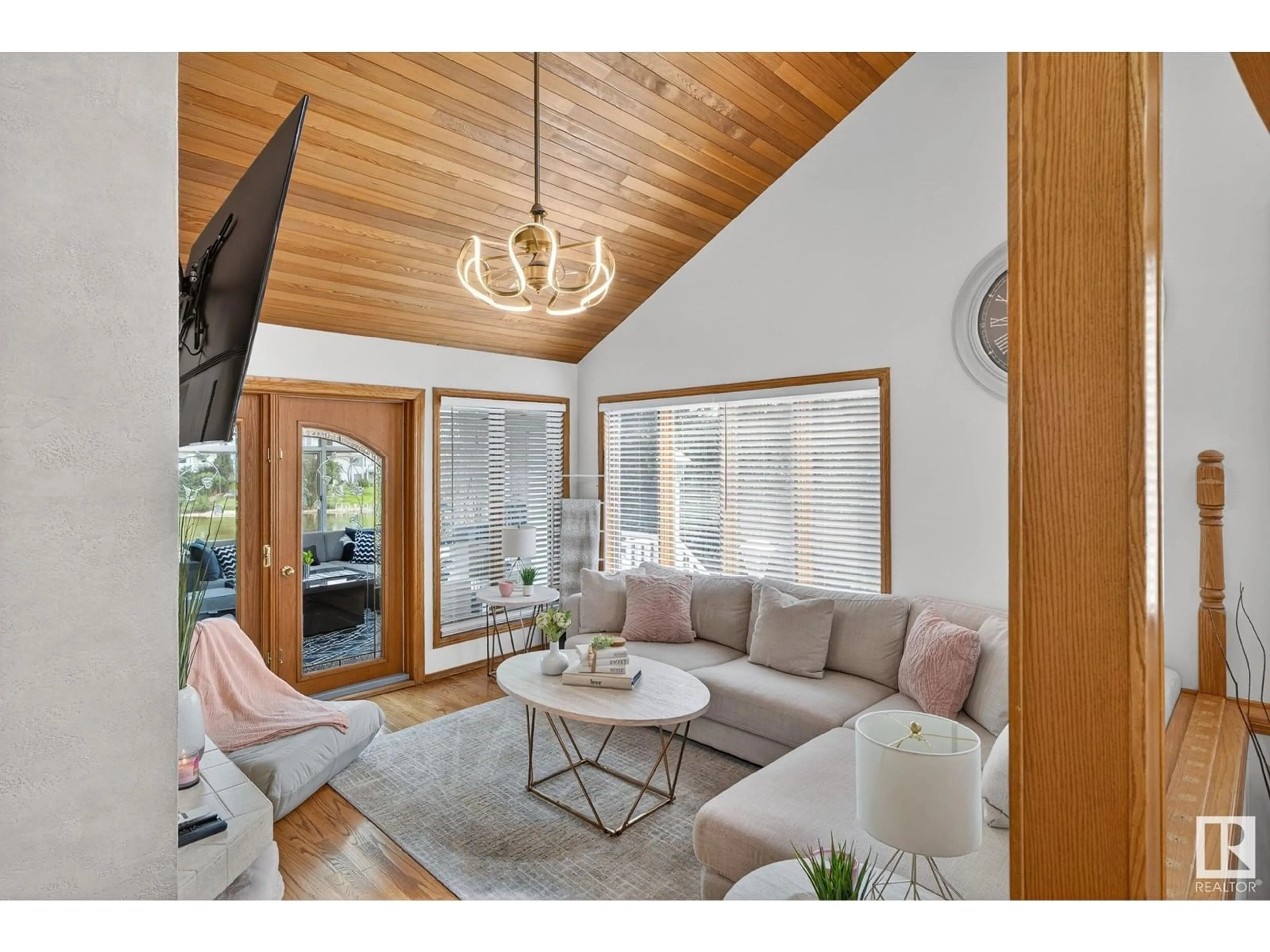 Living room with furniture, wood/laminate floor for 7604 157 AV NW, Edmonton Alberta T5Z2S2