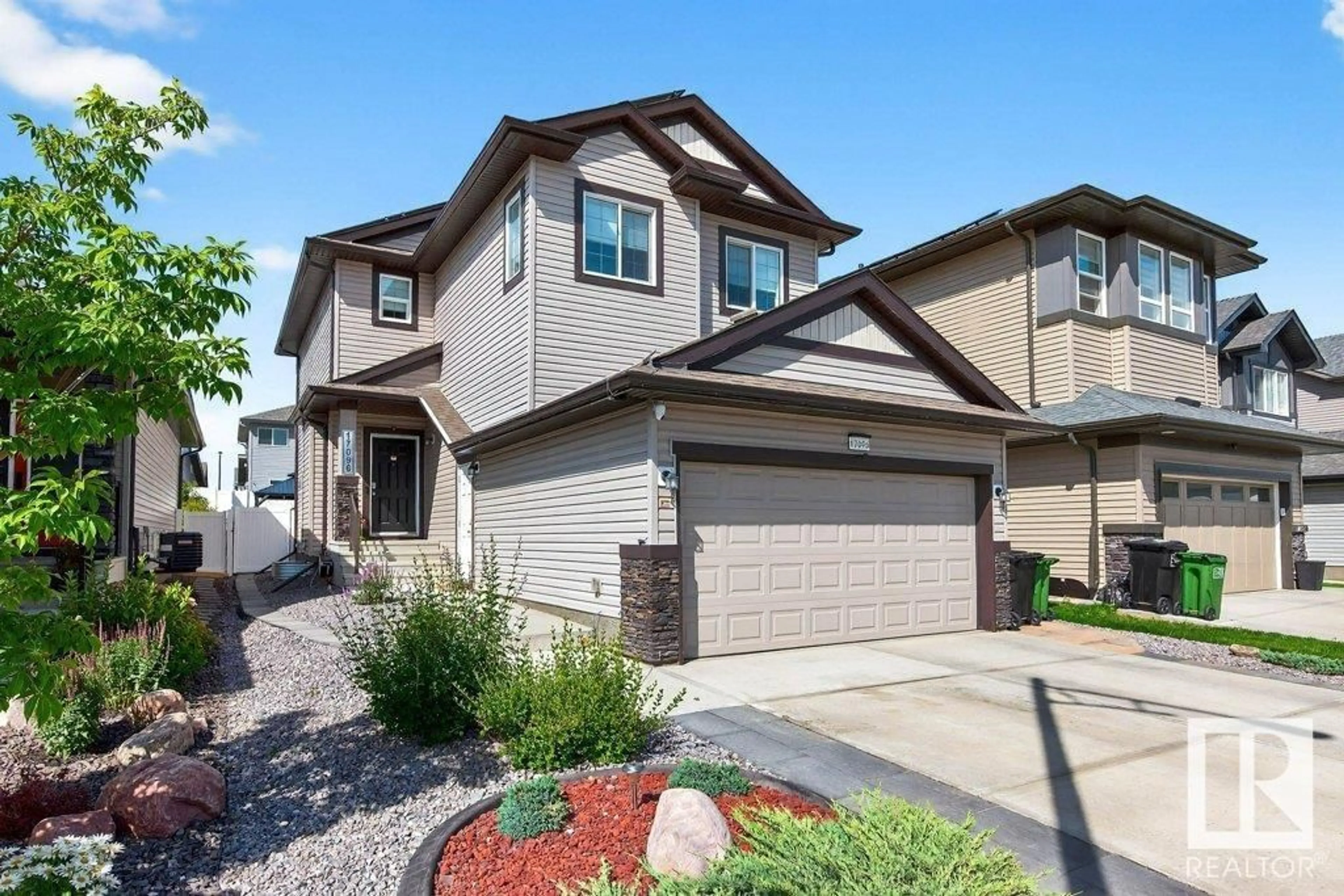 Home with vinyl exterior material, street for 17096 46 ST, Edmonton Alberta T5Y4B1