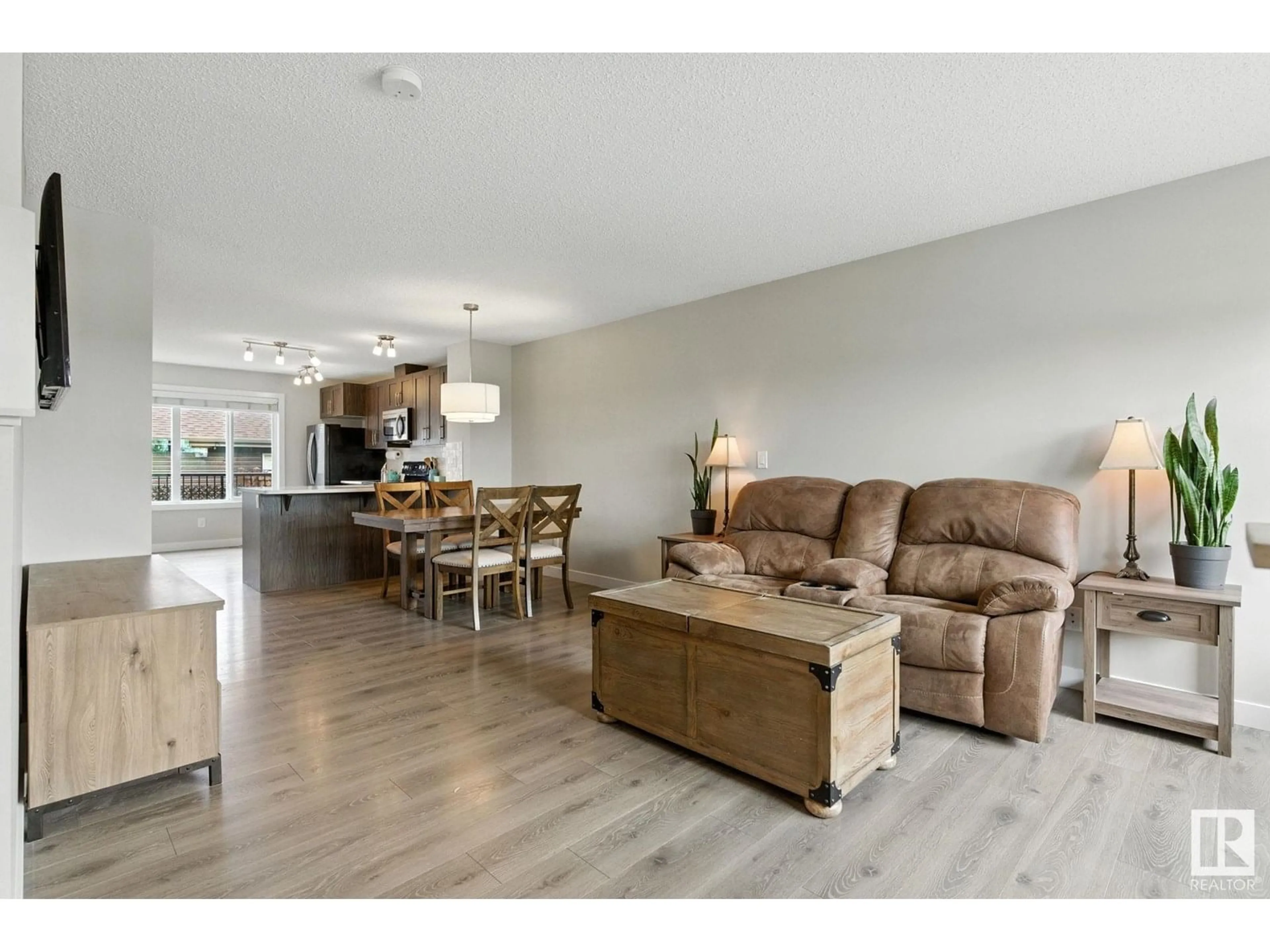 Living room with furniture, wood/laminate floor for 368 CRYSTALLINA NERA DR, Edmonton Alberta T5Z0R9