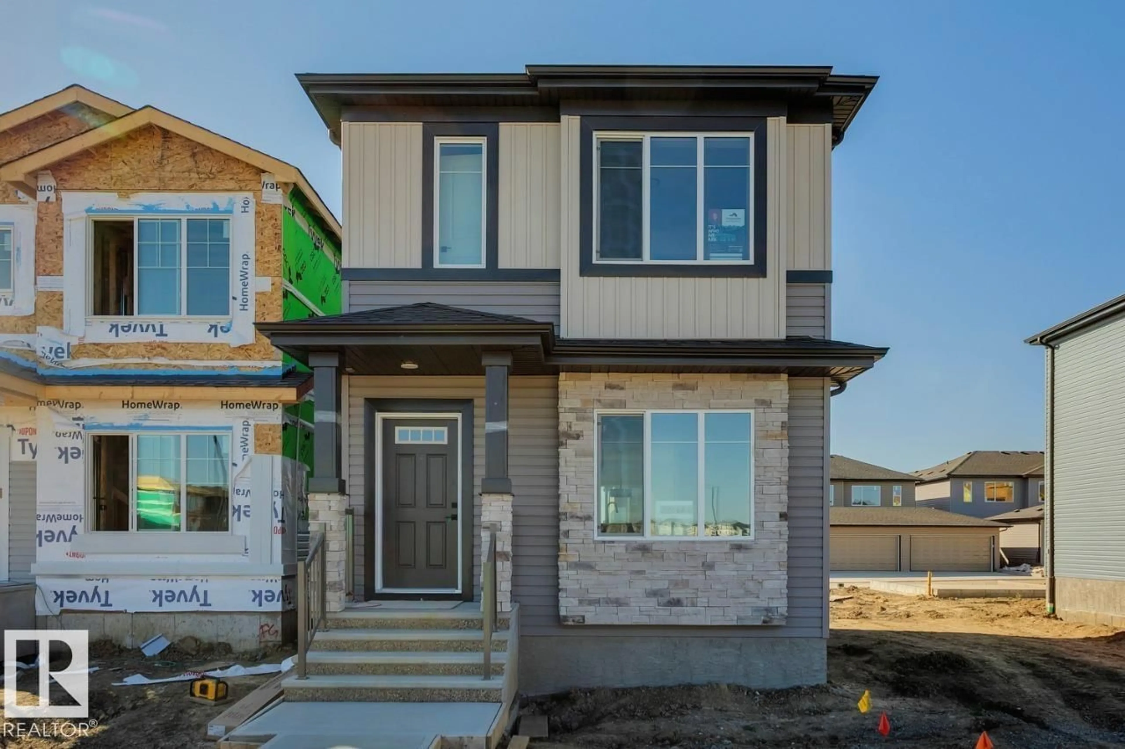 Home with brick exterior material, street for 203 WATTLE RD, Leduc Alberta T9E1L3