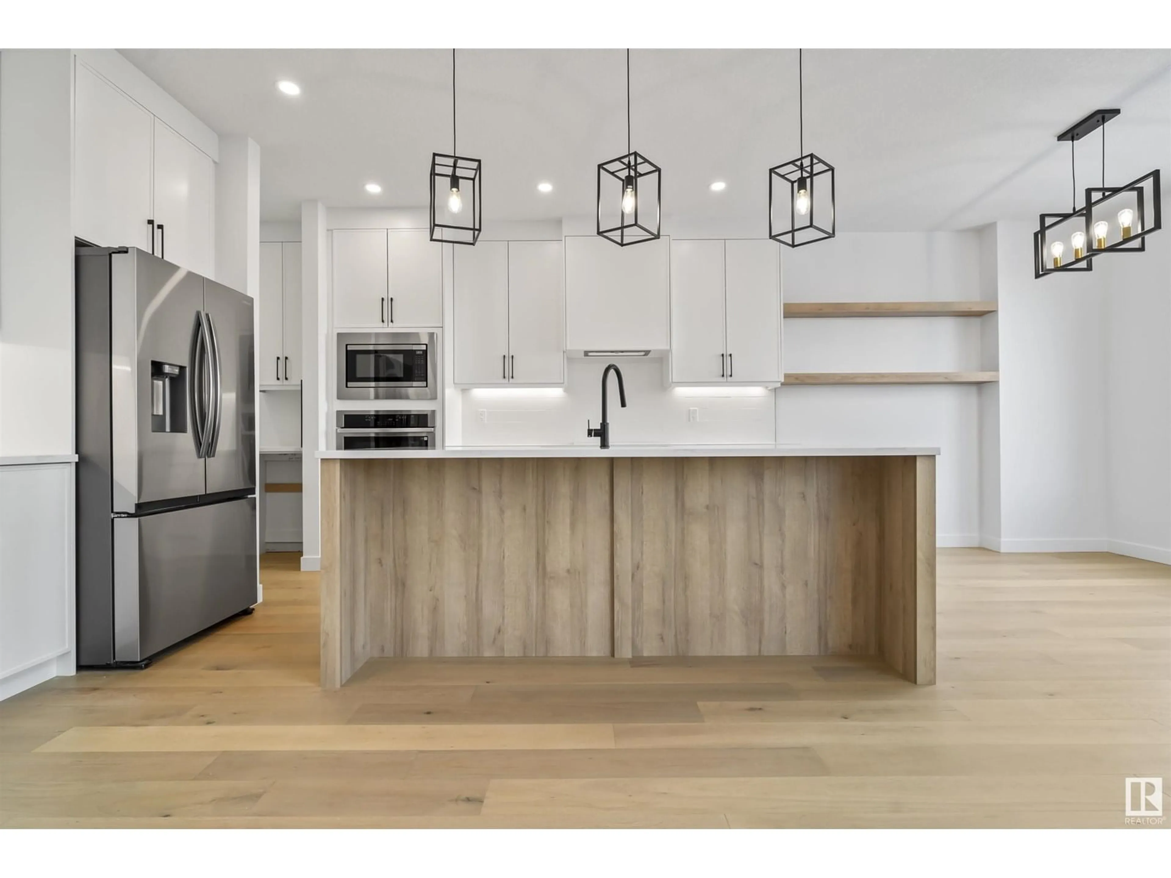 Open concept kitchen, wood/laminate floor for 22526 98A AV, Edmonton Alberta T5T7R7