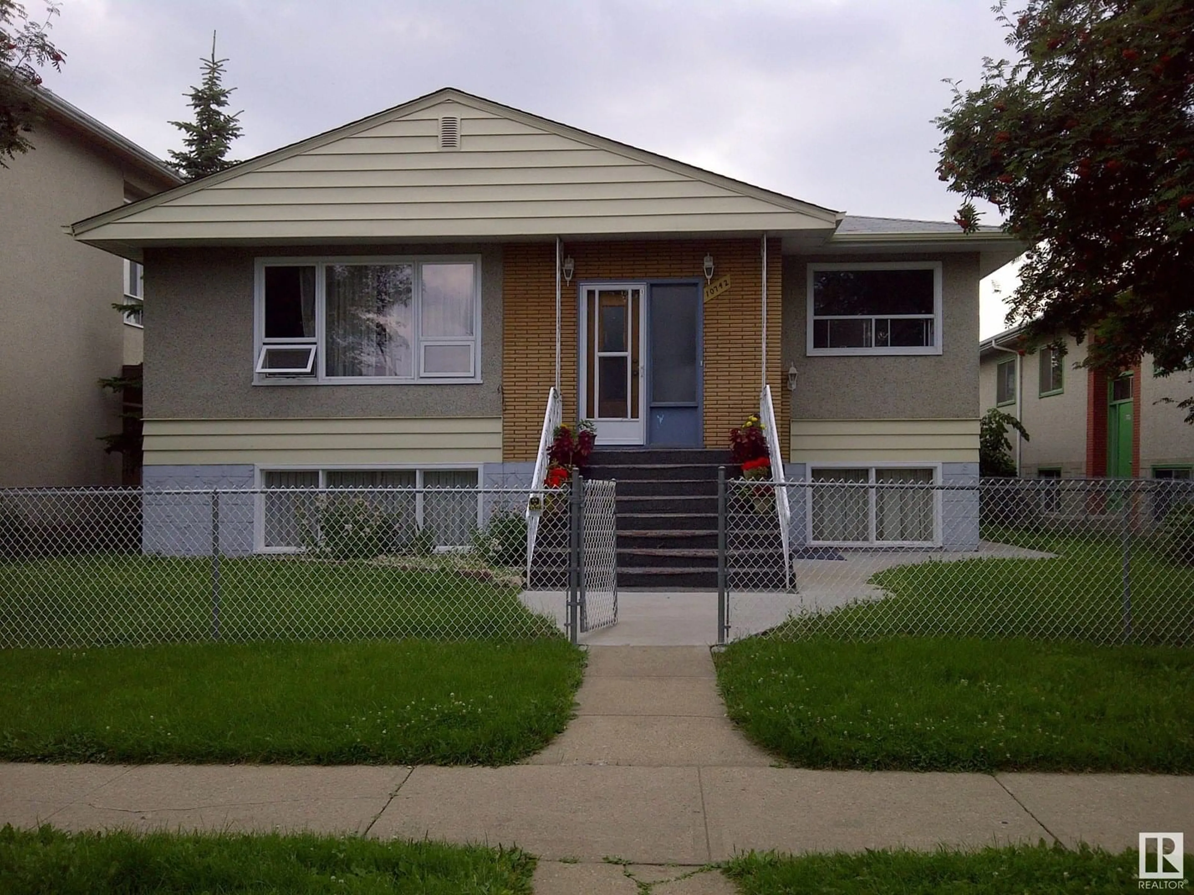 Home with vinyl exterior material, street for 10742 106 ST, Edmonton Alberta T5H2X9