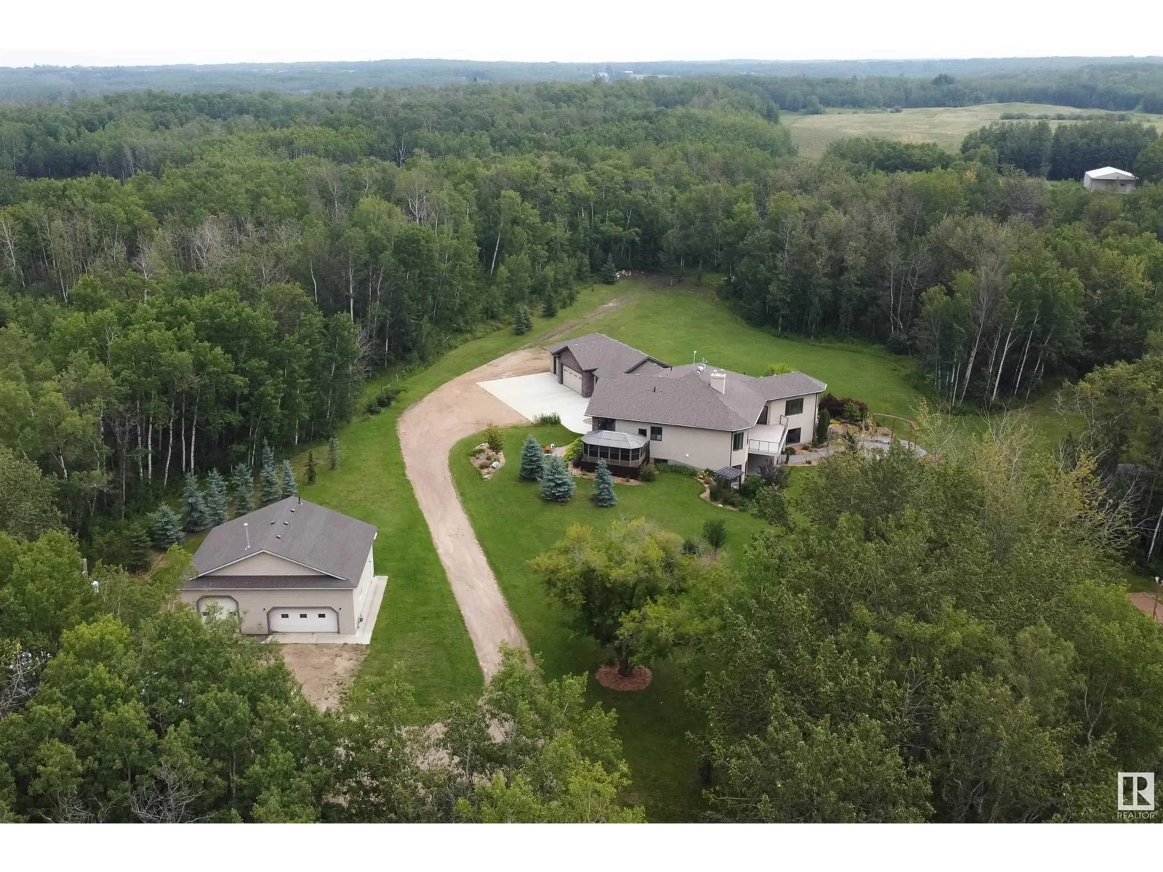 A pic from outside/outdoor area/front of a property/back of a property/a pic from drone, forest/trees view for 52449 RGE ROAD 214, Rural Strathcona County Alberta T8E2G8