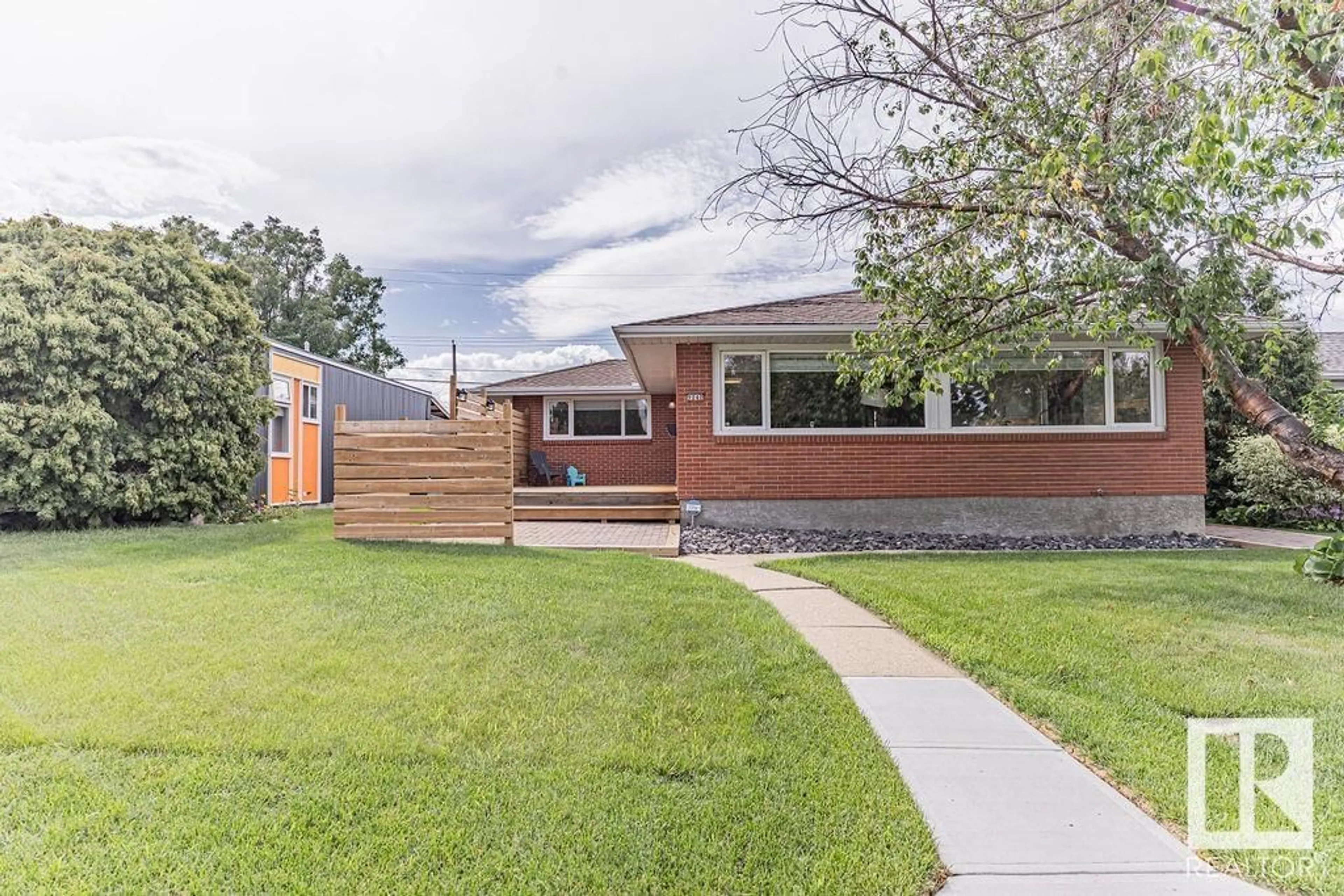 Home with brick exterior material, street for 9040 52 ST, Edmonton Alberta T6B1G2