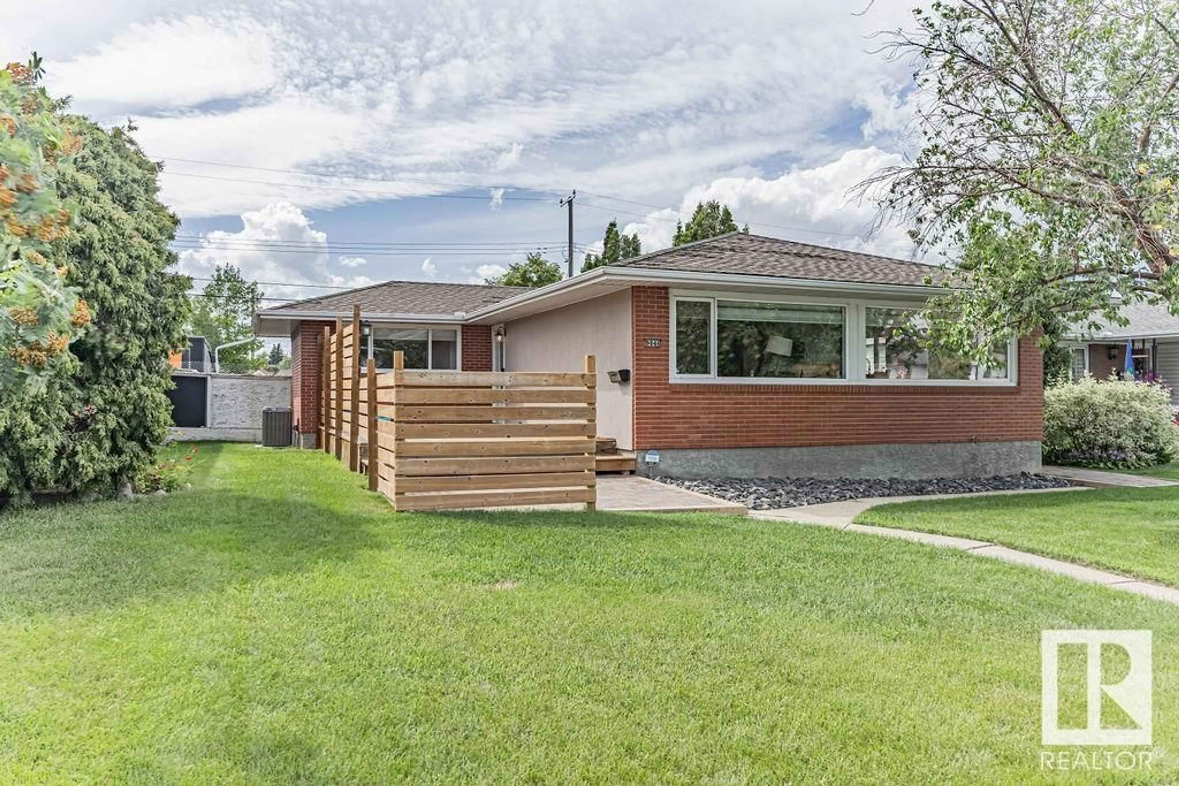 Home with brick exterior material, street for 9040 52 ST, Edmonton Alberta T6B1G2