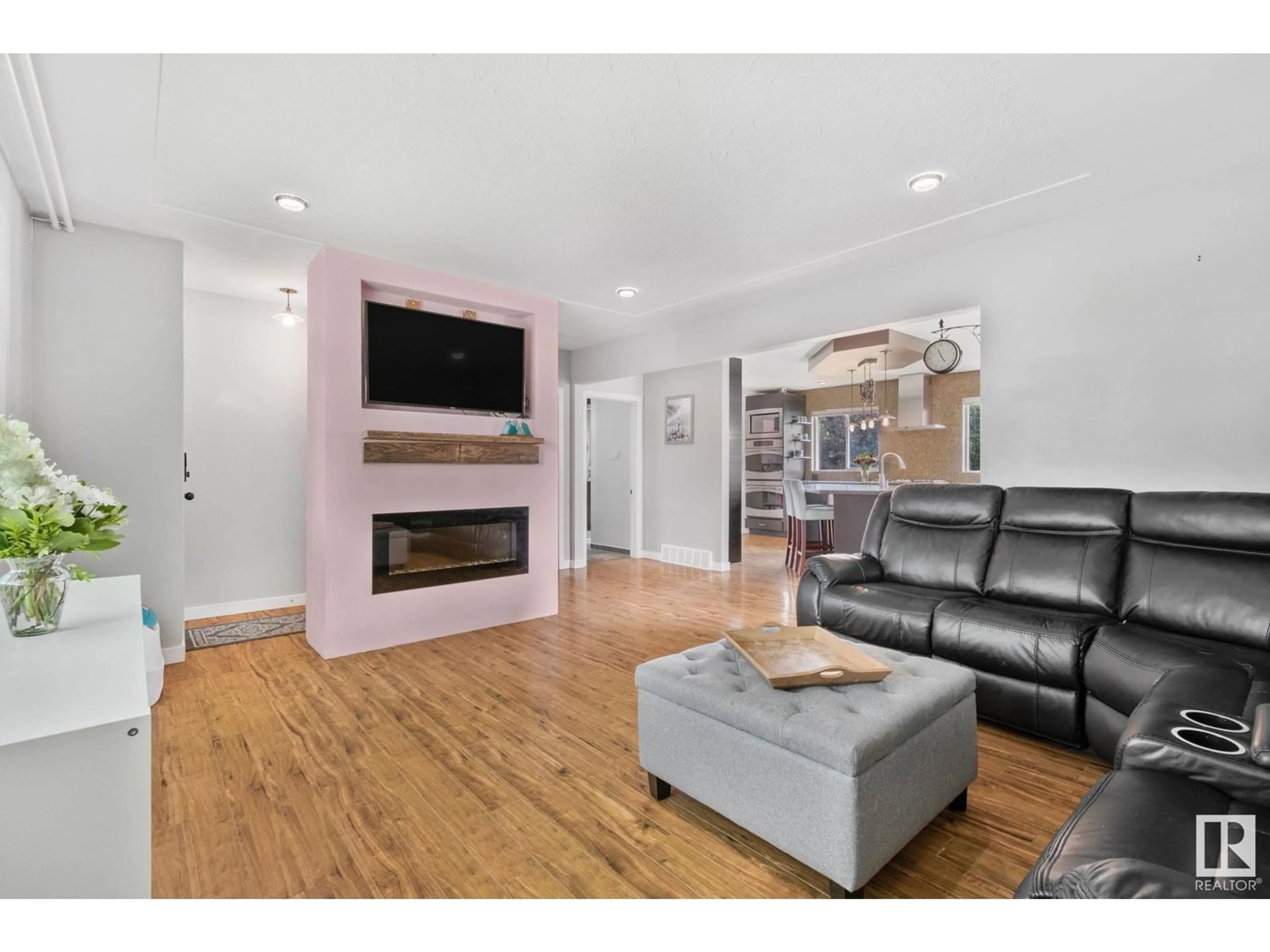 Living room with furniture, wood/laminate floor for 3613 113 AV, Edmonton Alberta T5W0P7