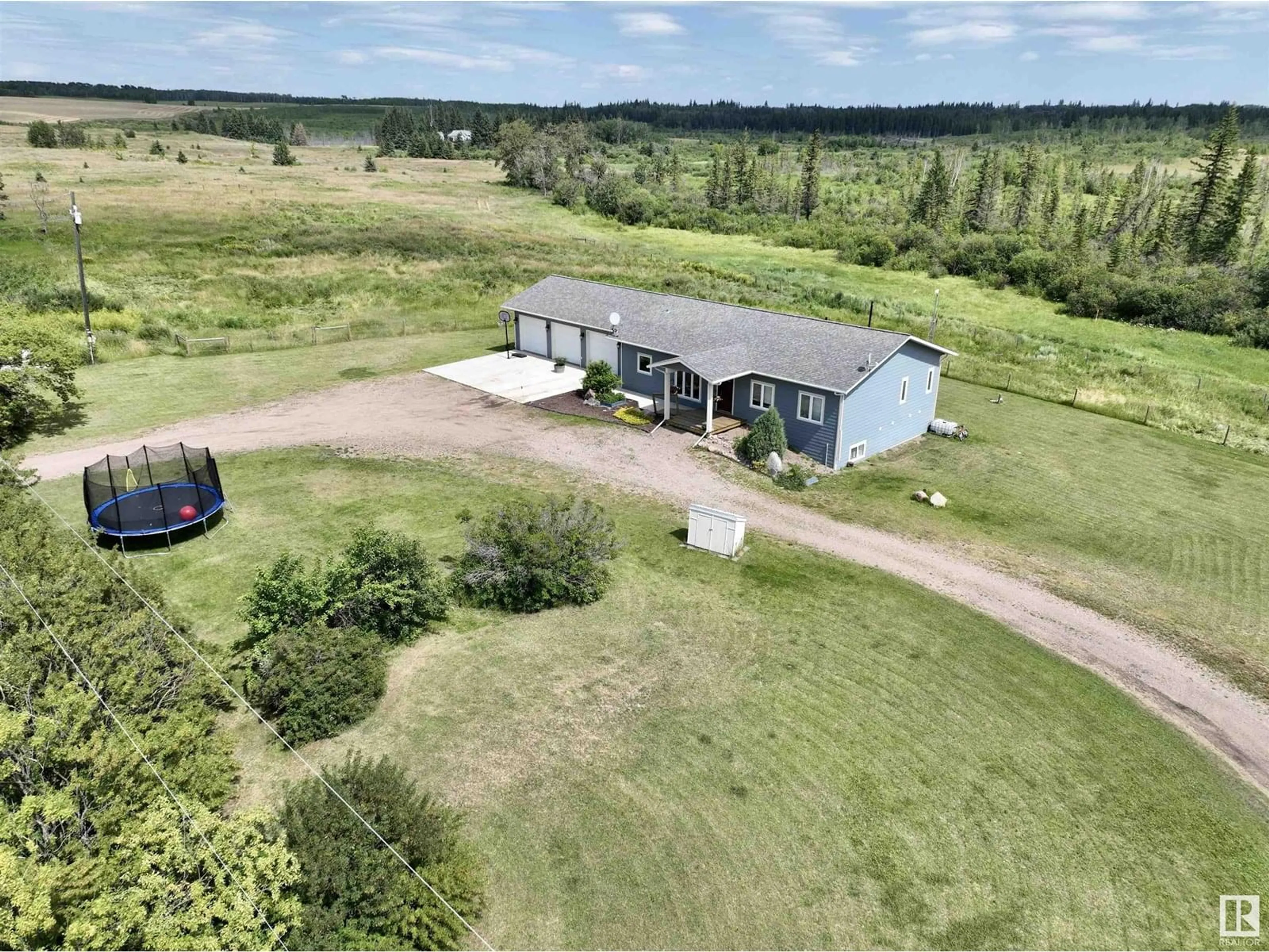 A pic from outside/outdoor area/front of a property/back of a property/a pic from drone, building for 11 - 28 54 W4, Rural Two Hills County Alberta T0B4K0
