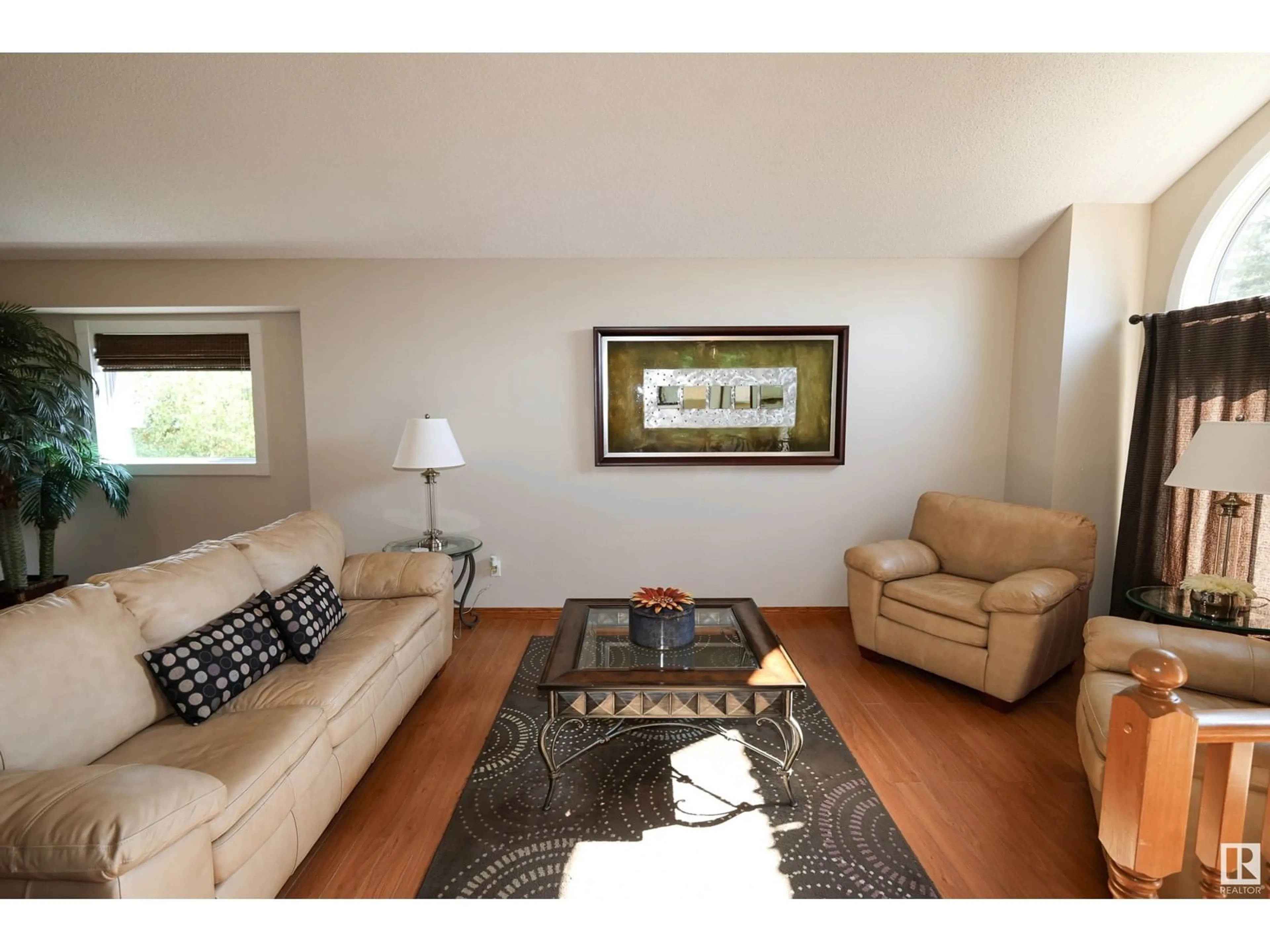 Living room with furniture, wood/laminate floor for 10408 89 ST, Morinville Alberta T8R1C6