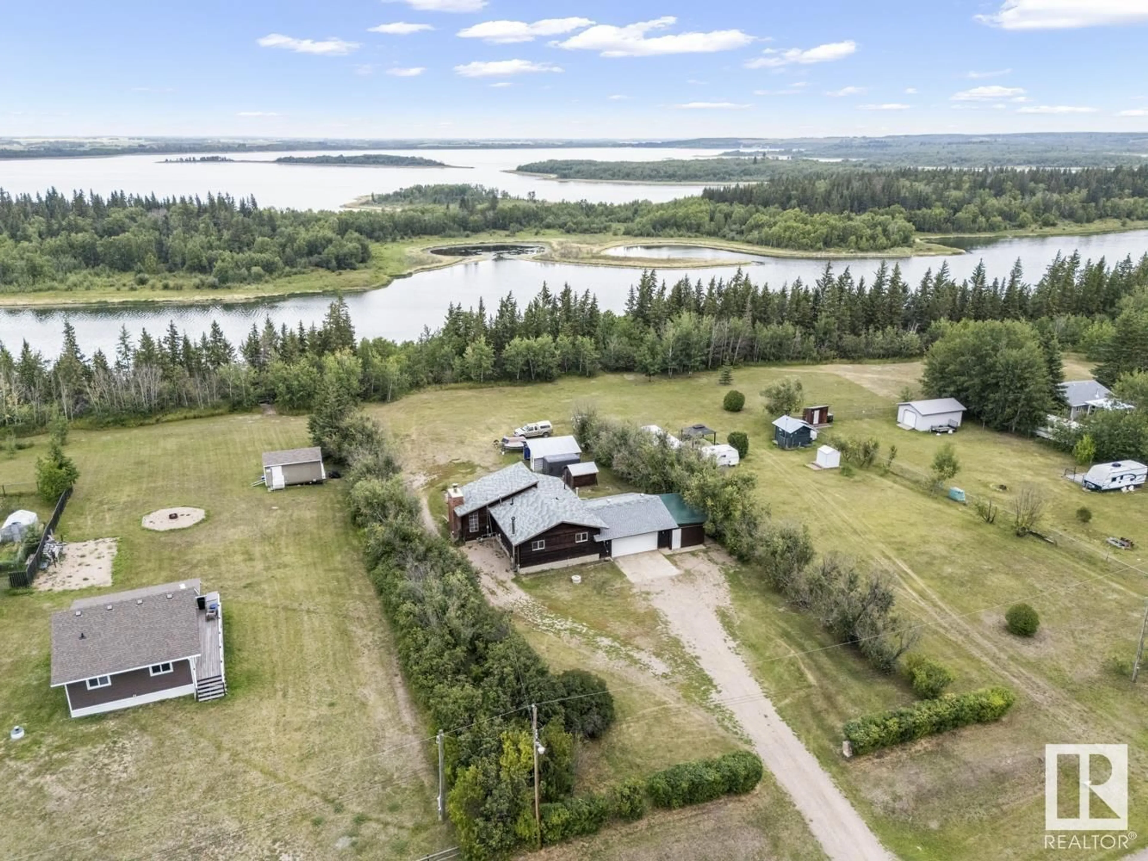 A pic from outside/outdoor area/front of a property/back of a property/a pic from drone, water/lake/river/ocean view for 260 - 57201 RNG RD, Rural St. Paul County Alberta T0A3A0