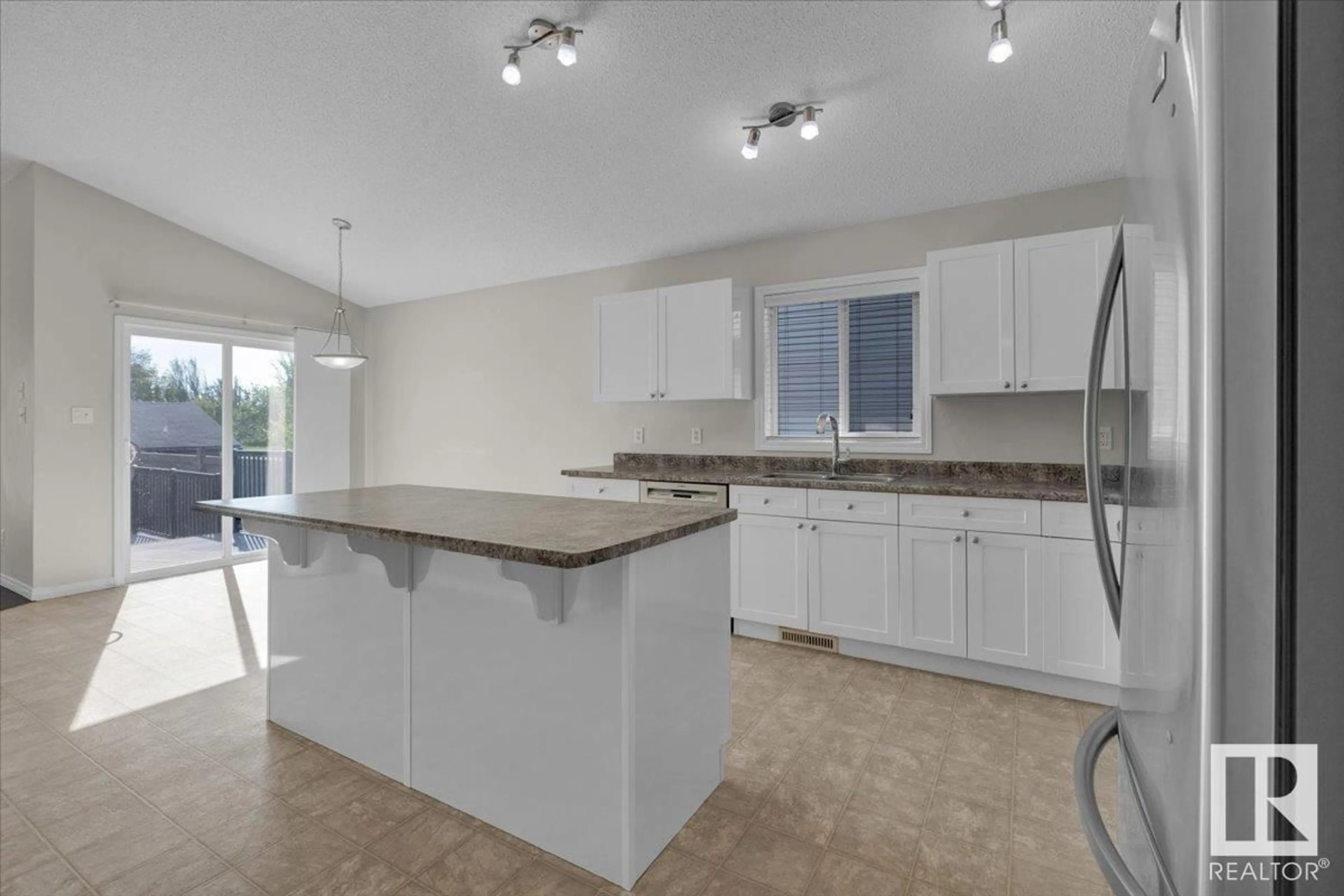 Open concept kitchen, ceramic/tile floor for 3407 25 ST, Edmonton Alberta T6T0B1