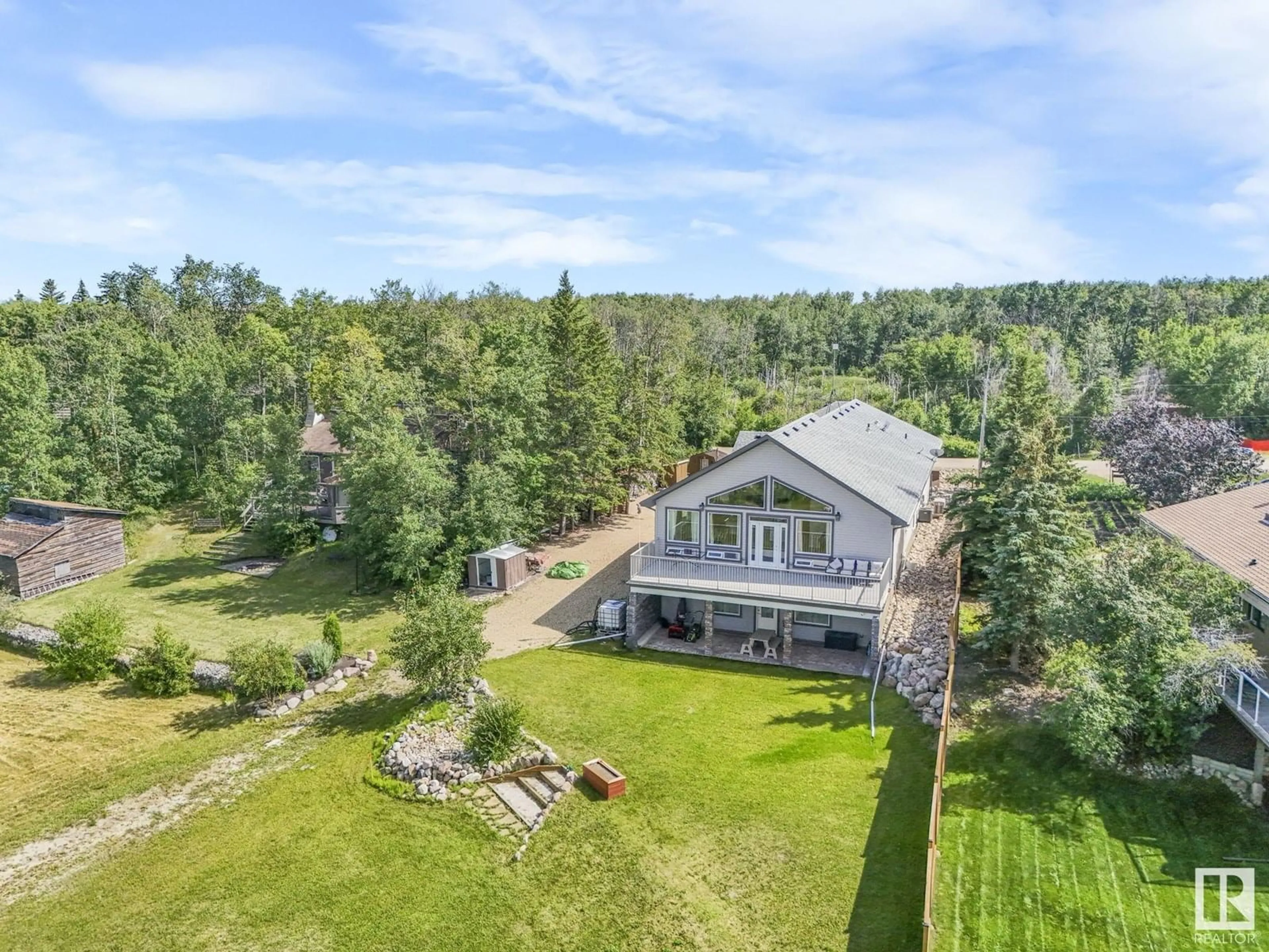A pic from outside/outdoor area/front of a property/back of a property/a pic from drone, water/lake/river/ocean view for #17 - 51263 RANGE ROAD 204, Rural Strathcona County Alberta T8G1E9