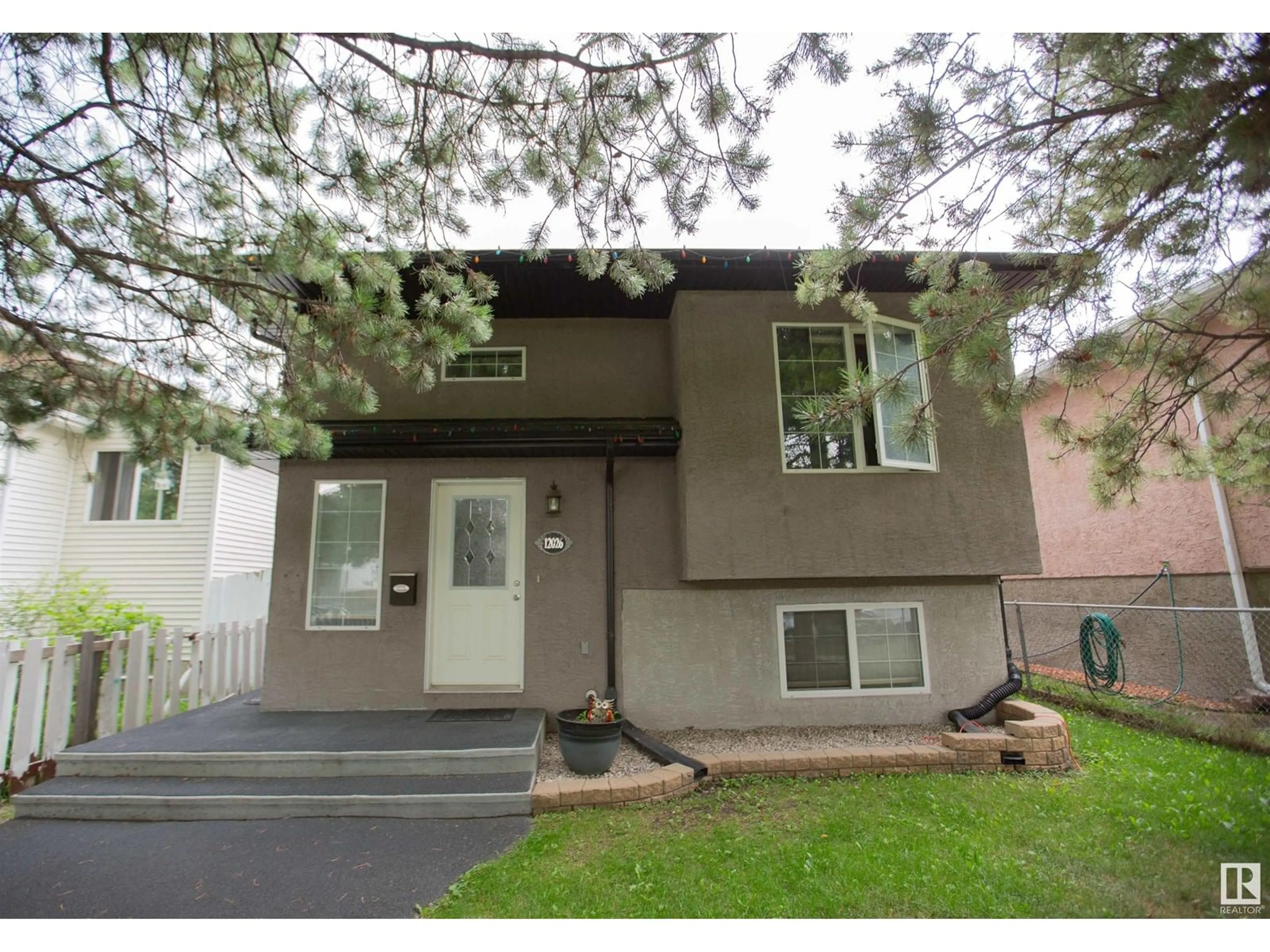 Home with vinyl exterior material, street for NW - 12026 91 ST, Edmonton Alberta T5B4B8