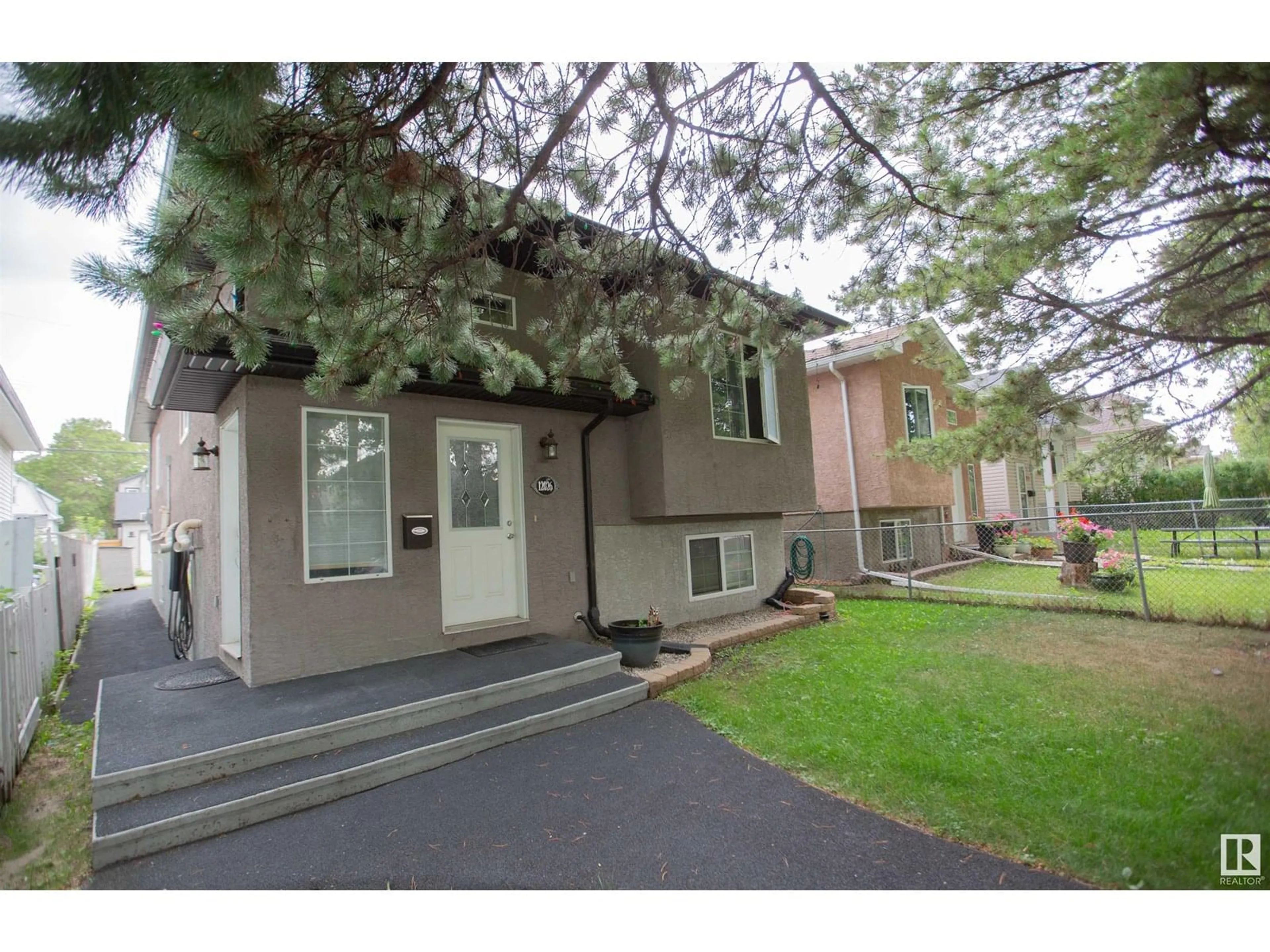 Home with vinyl exterior material, street for NW - 12026 91 ST, Edmonton Alberta T5B4B8
