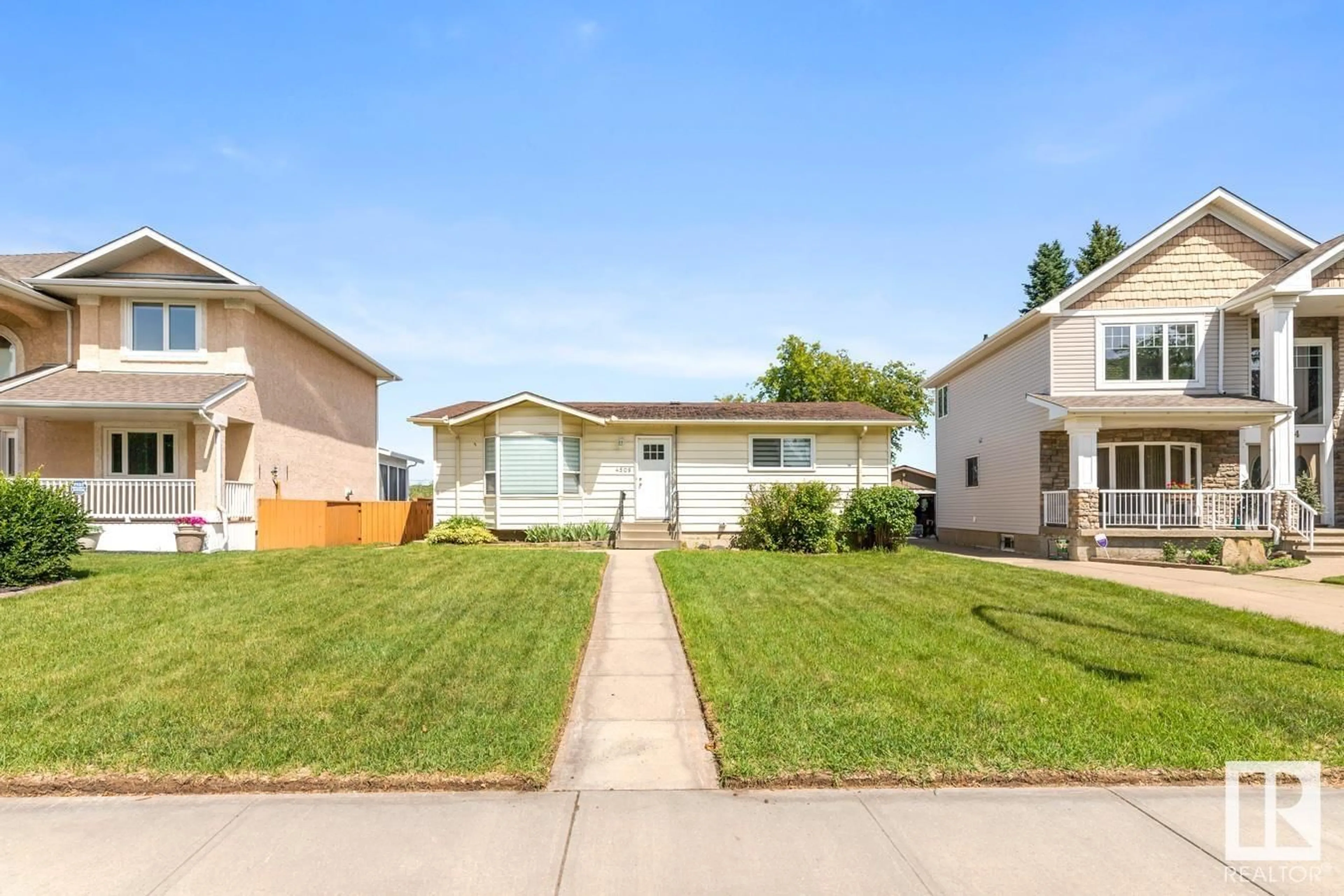 Home with vinyl exterior material, street for 4508 109A AV, Edmonton Alberta T6A1S4