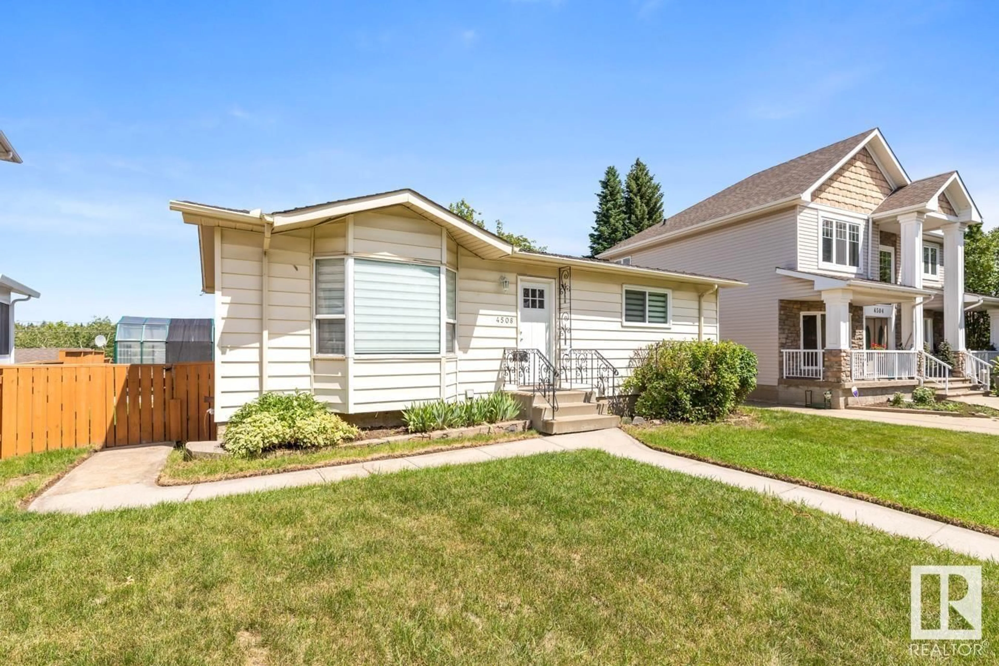 Home with vinyl exterior material, street for 4508 109A AV, Edmonton Alberta T6A1S4