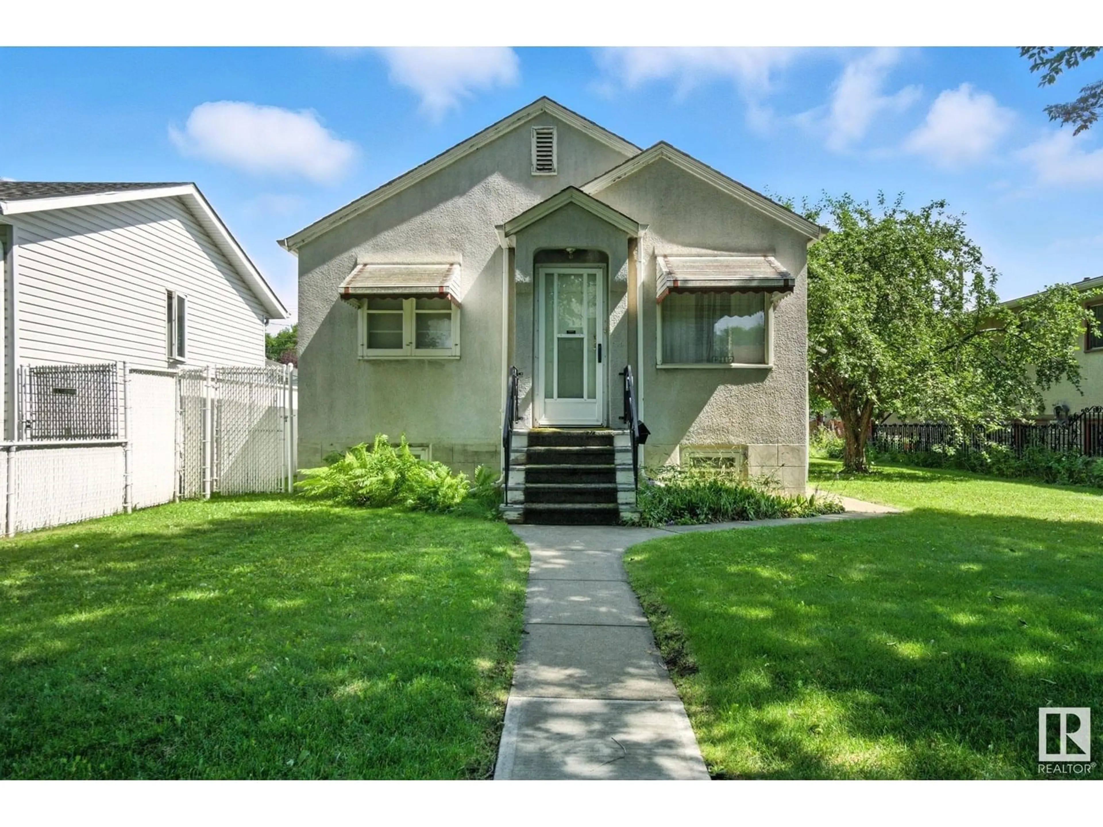 Home with vinyl exterior material, street for NW - 12117 85 ST, Edmonton Alberta T6X1C7