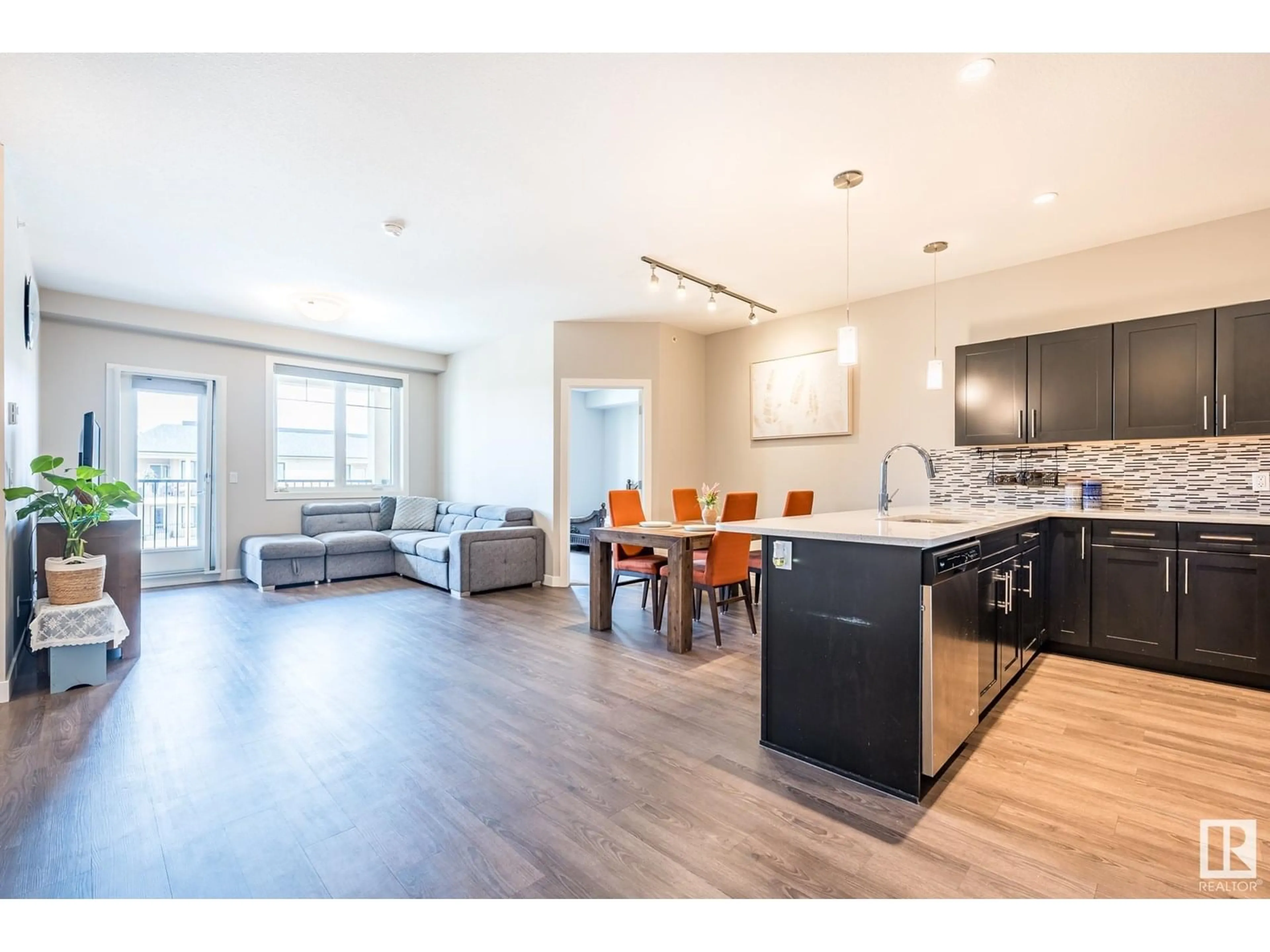 Open concept kitchen, wood/laminate floor for 401 - 1031 173 ST, Edmonton Alberta T6W3E4