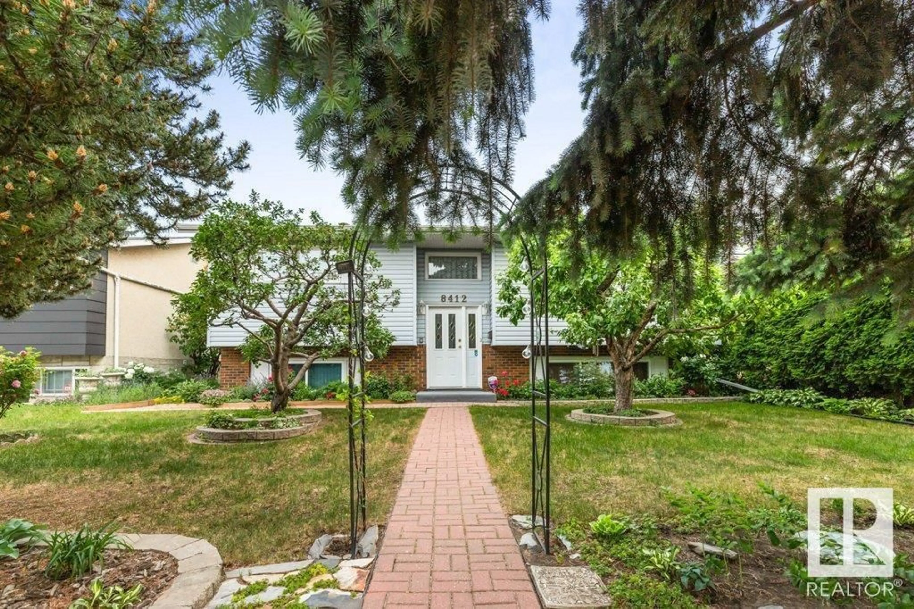 Home with brick exterior material, street for 8412 149A AV, Edmonton Alberta T5E2Z2