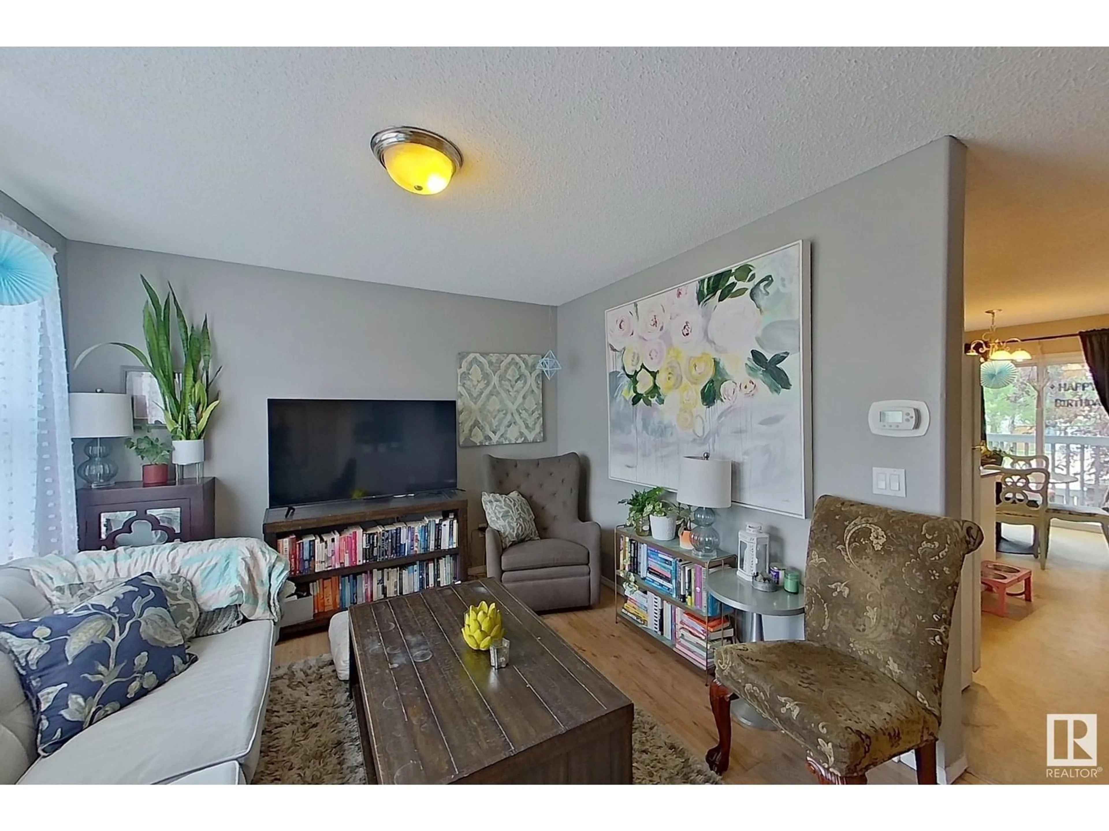 Living room with furniture, wood/laminate floor for #10 - 16777 91 STREET, Edmonton Alberta T5Z3X4