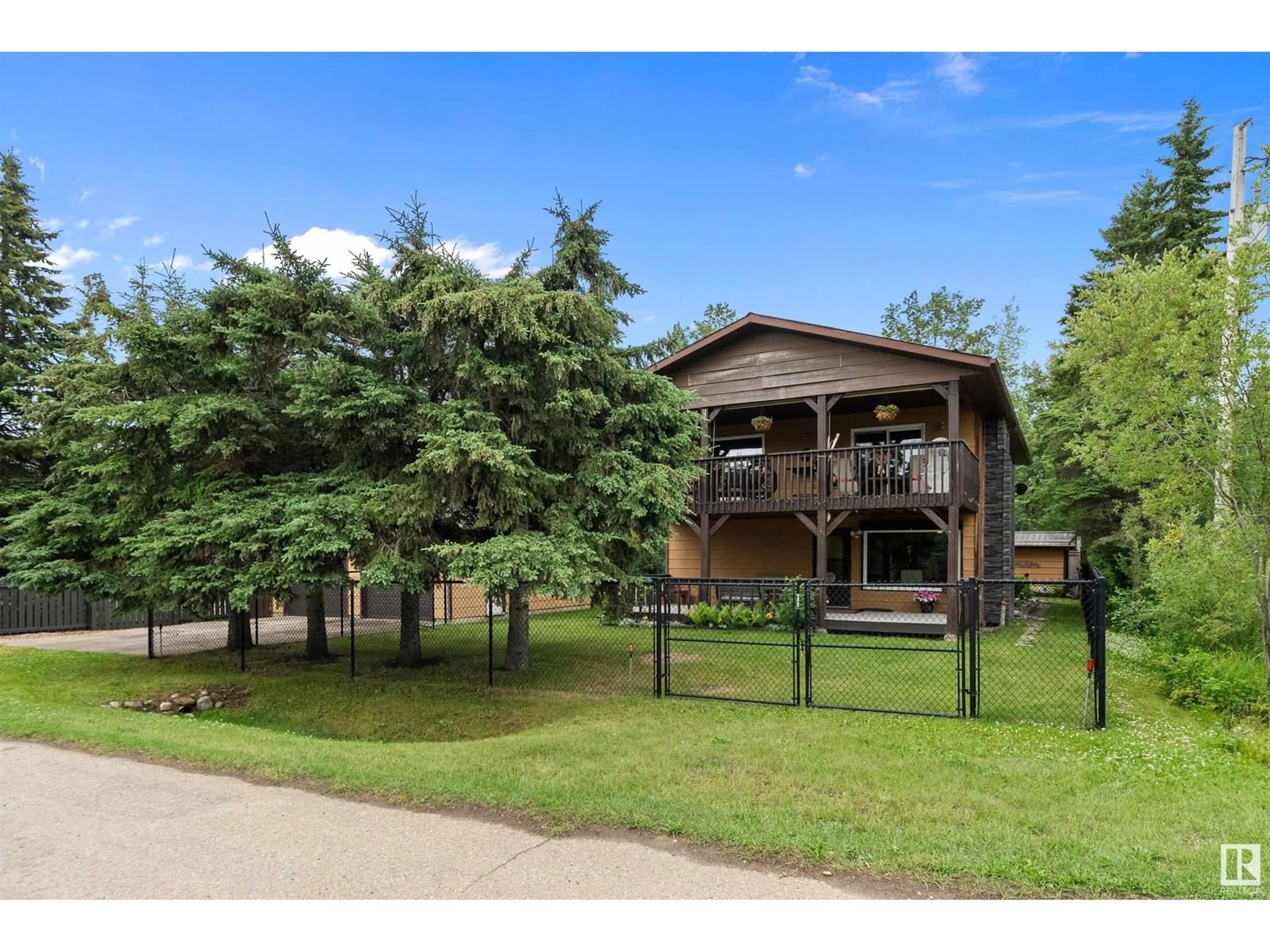 A pic from outside/outdoor area/front of a property/back of a property/a pic from drone, water/lake/river/ocean view for 110 1ST AV, Rural Wetaskiwin County Alberta T0C1X0