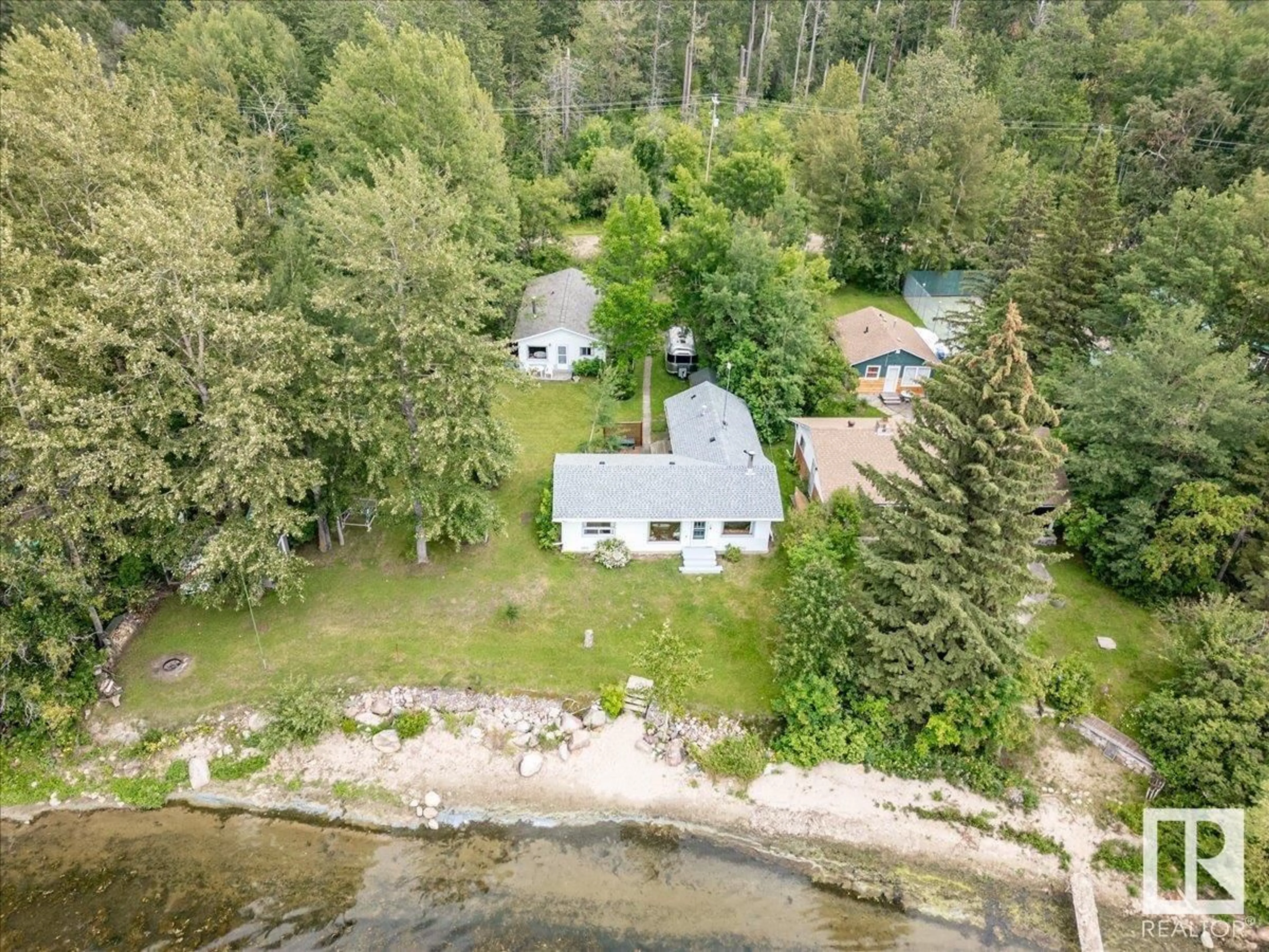 A pic from outside/outdoor area/front of a property/back of a property/a pic from drone, water/lake/river/ocean view for 59 BEACH AVE, Rural Leduc County Alberta T0C2C0
