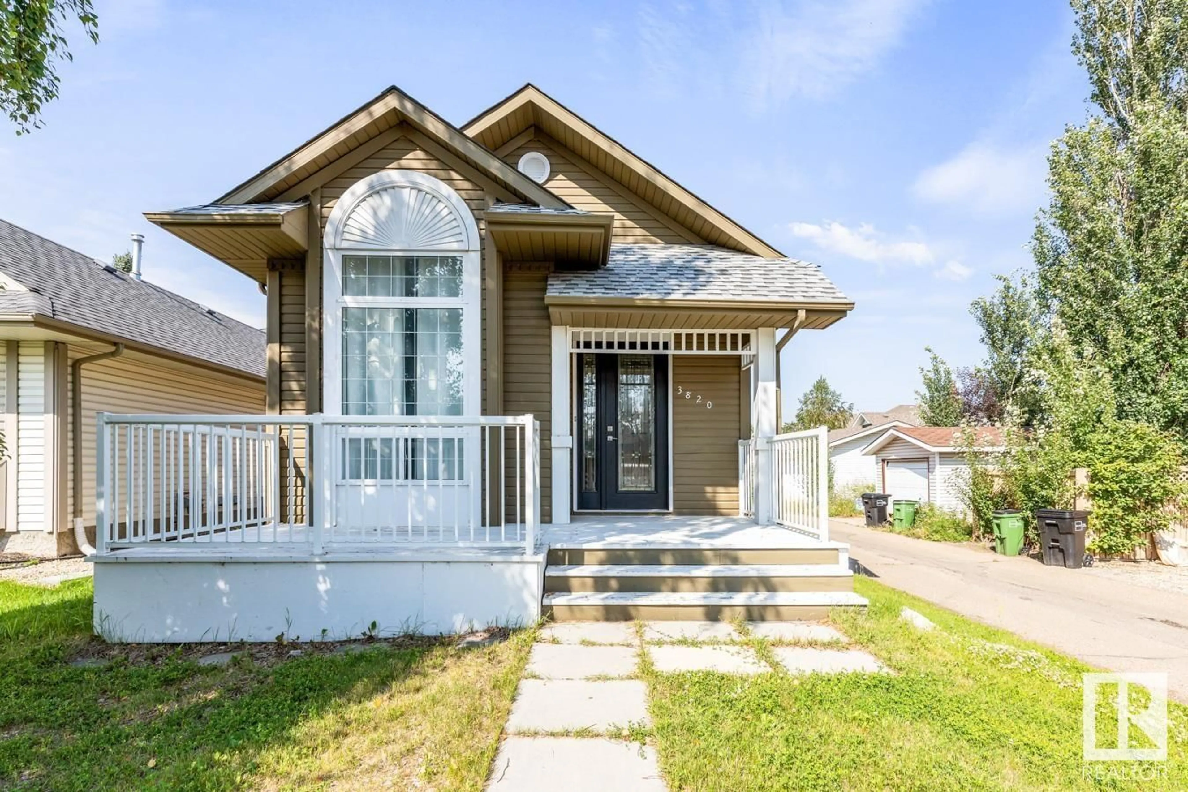 Home with vinyl exterior material, street for 3820 23 ST, Edmonton Alberta T6T1K7