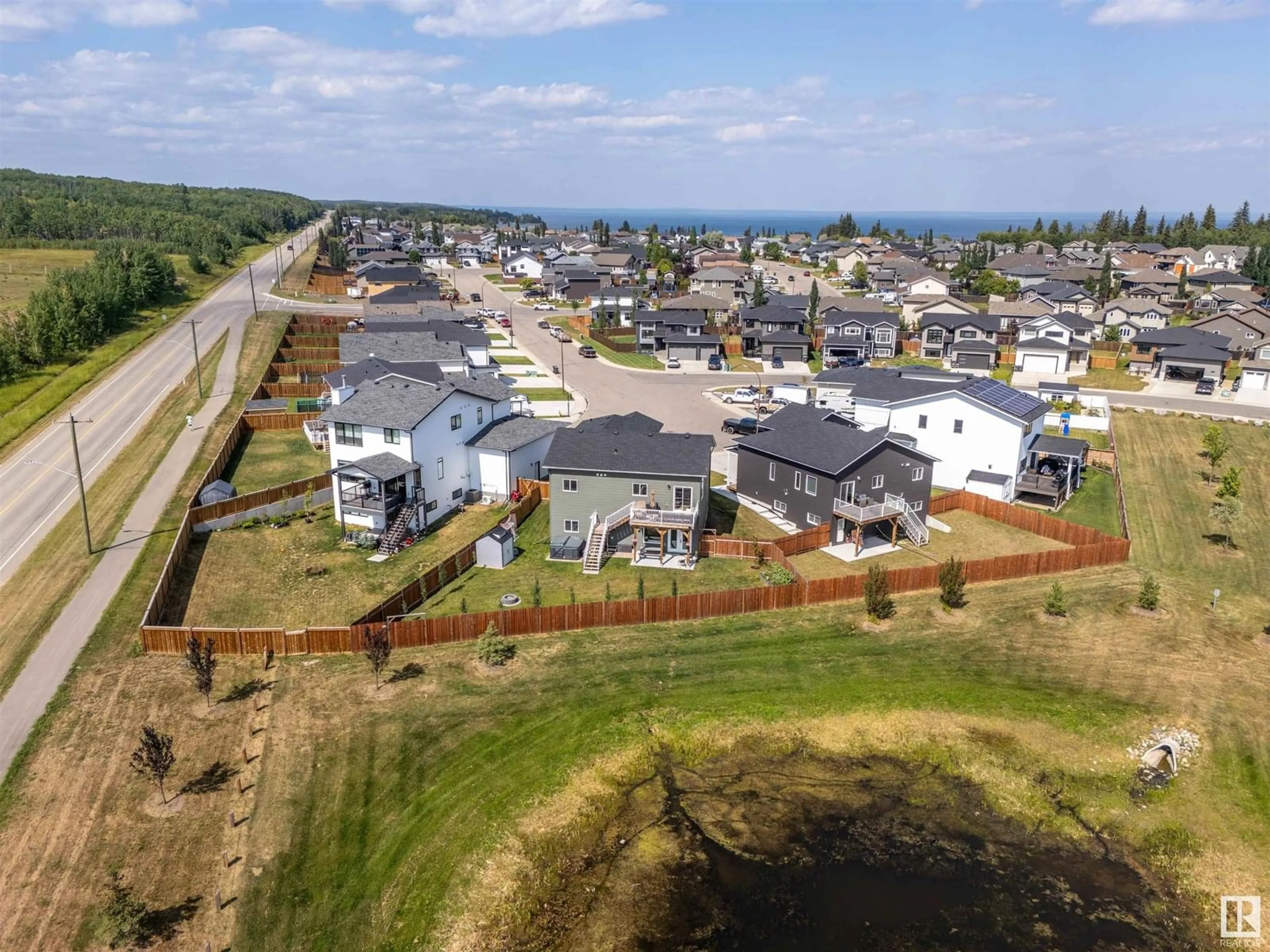 A pic from outside/outdoor area/front of a property/back of a property/a pic from drone, water/lake/river/ocean view for 410 LAKEWOOD WY, Cold Lake Alberta T9M0K7