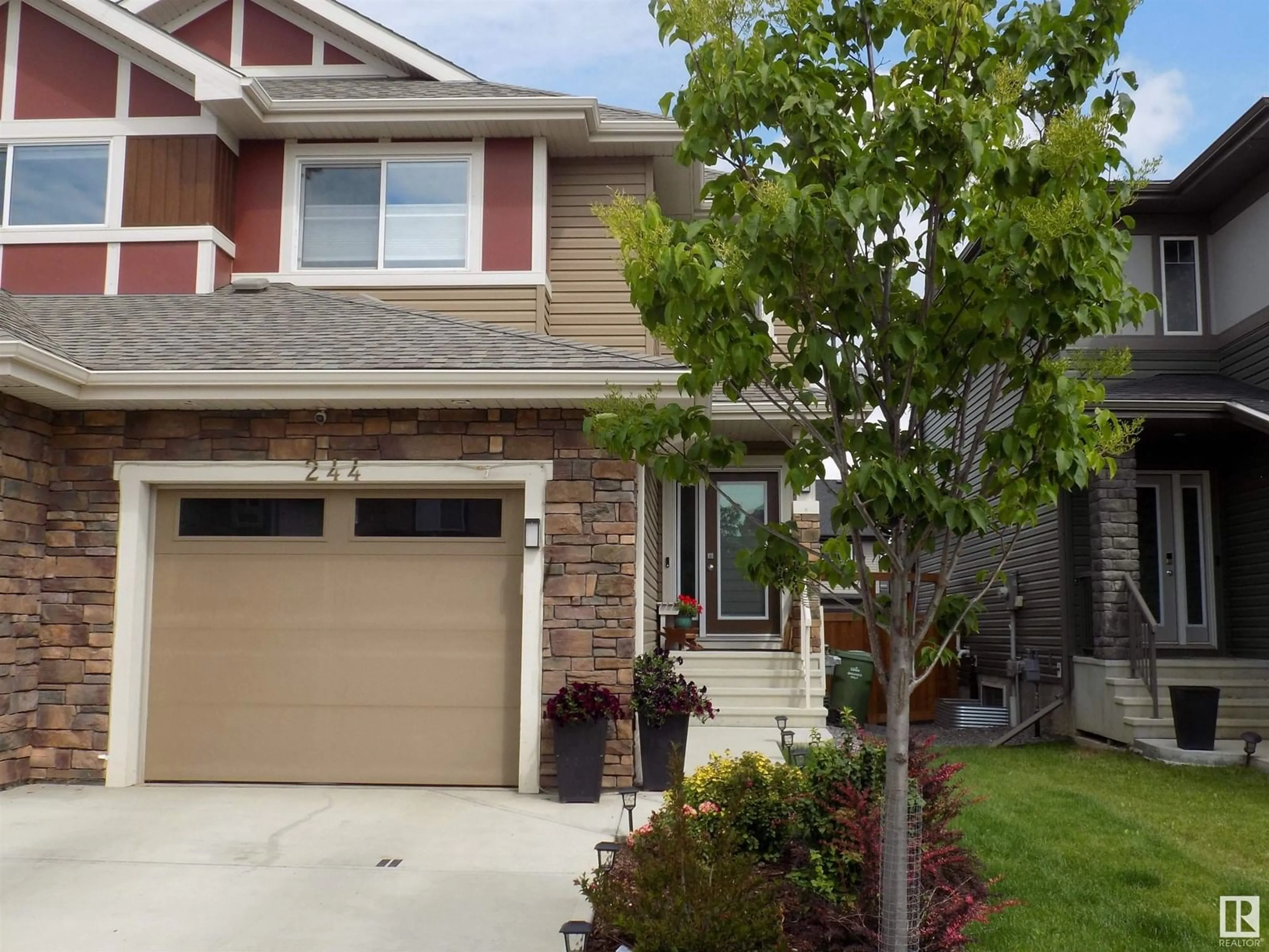Home with vinyl exterior material, street for 244 LARCH CRESCENT, Leduc Alberta T9E1L3
